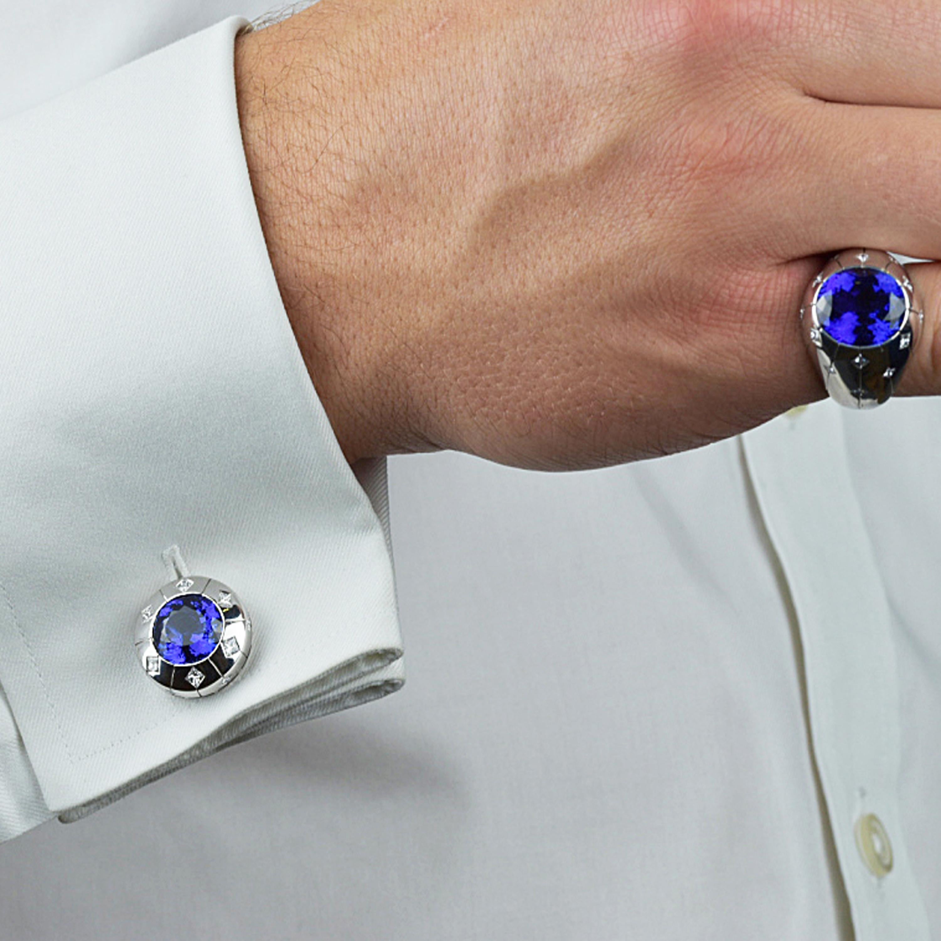 Matthew Cambery 18K White Gold Cufflinks set with stunning luxurious Oval Tanzanites totalling 13.29 Carat with further beautification of Princess Cut Diamonds totalling 1.47 Carats. T Bar fitting with oval backplate.
Matthew Cambery 18K White Gold