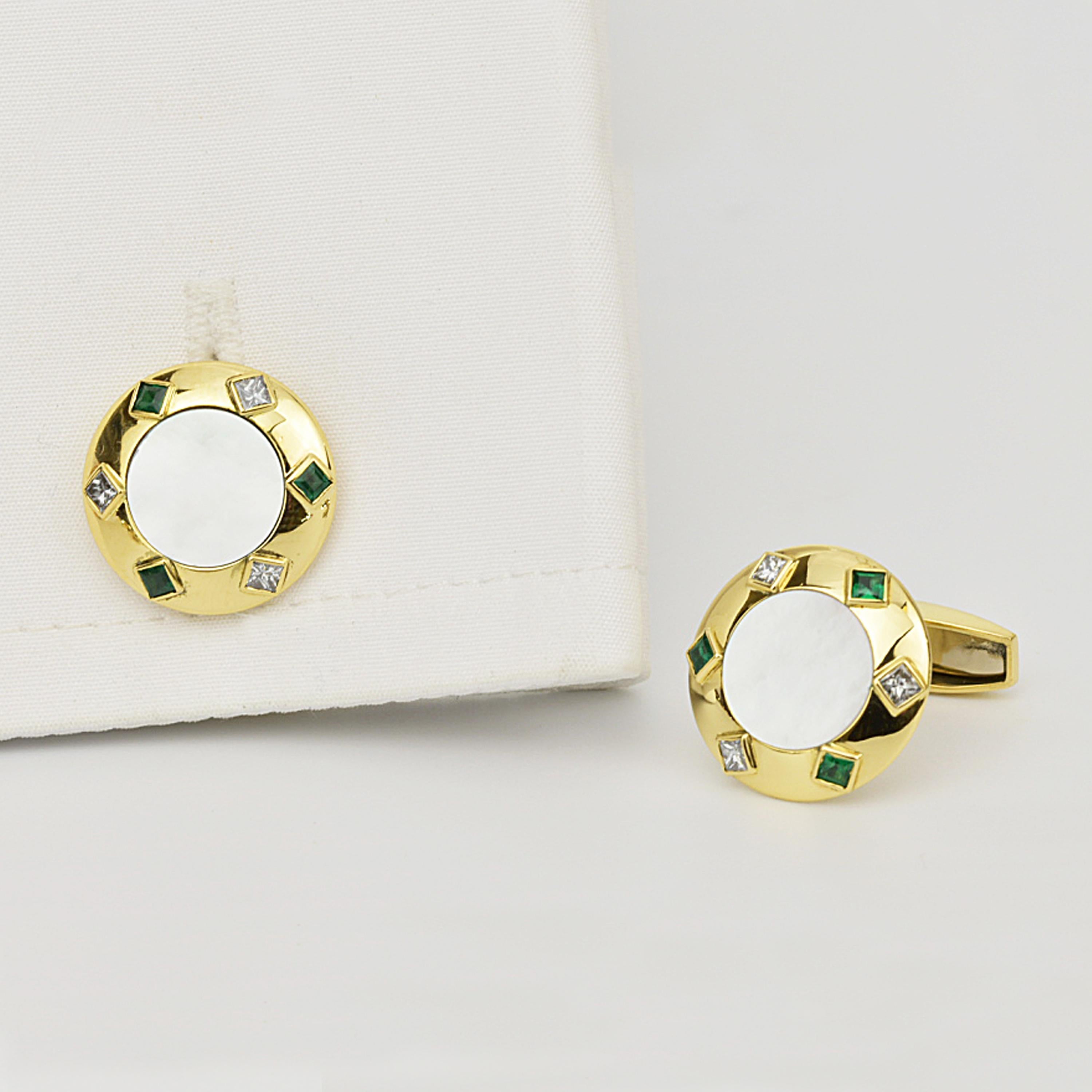 Matthew Cambery 18K Yellow Gold Cufflinks set with a central mother of pearl disc and surrounded by alternating princess cut diamonds and square emeralds. Diamonds total 0.30ct. T Bar Fitting.

