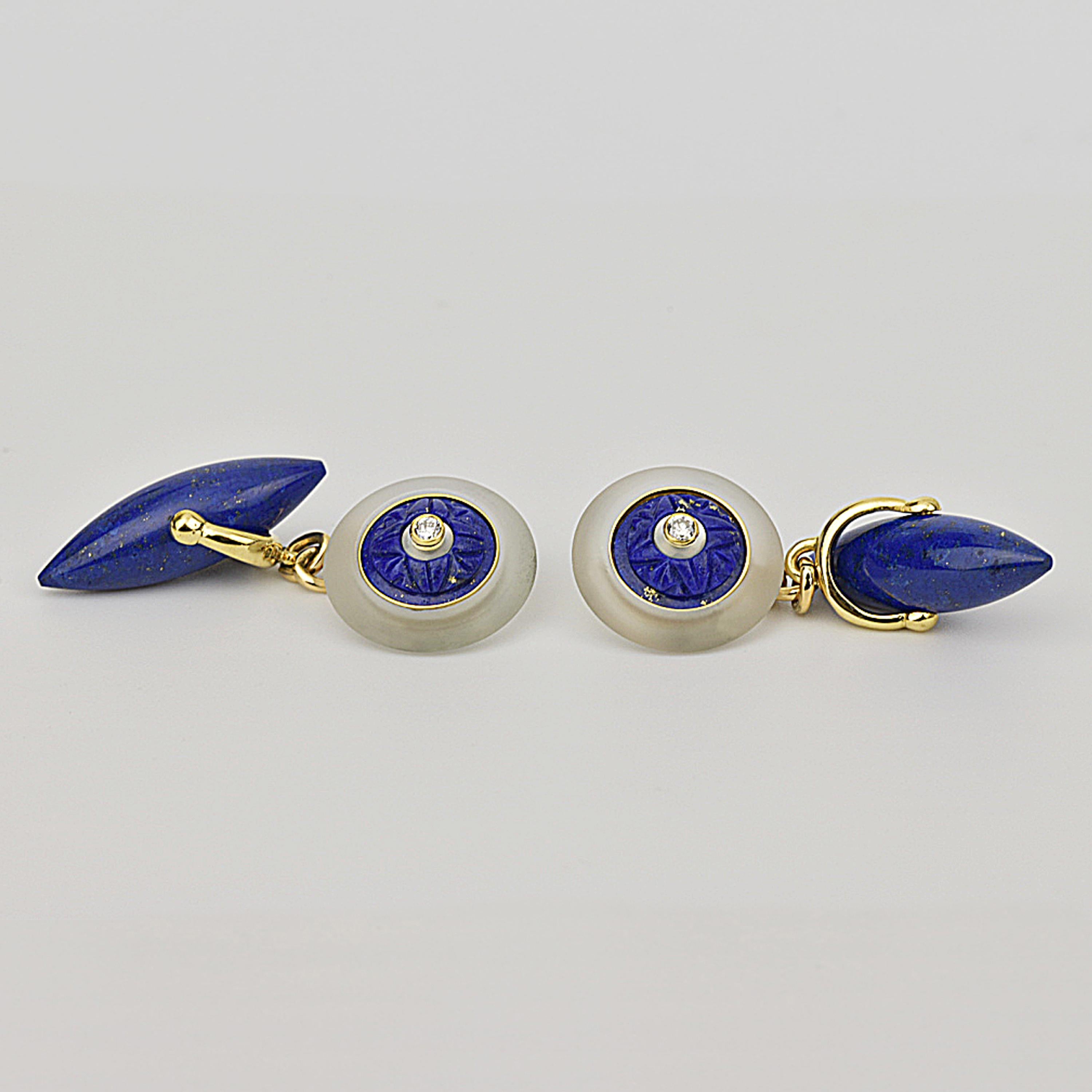 Matthew Cambery 18K yellow gold and white gold rock crystal cufflinks set with a central diamond surrounded by a ring of mother-of-pearl and further embellished with a section of carved lapis lazuli. Chain connecting cufflinks with a lapis lazuli