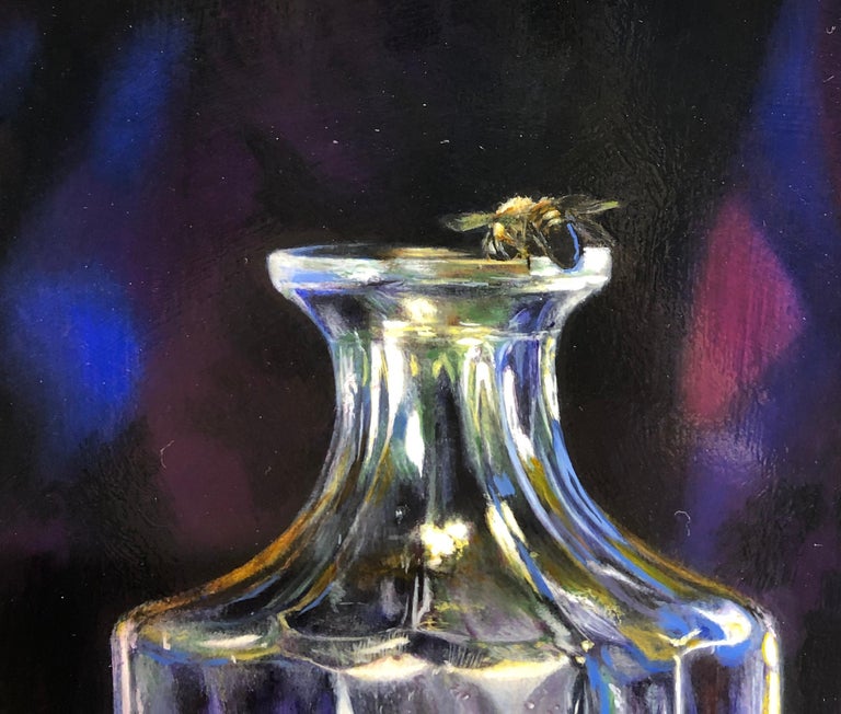 While still life painting can be dated back to the Ancient Egyptians, this still life takes on a modern theme.  A crystal decanter and whiskey glass are set upon a piece of fraying tapestry.  The curiosity comes when the viewer takes a closer look