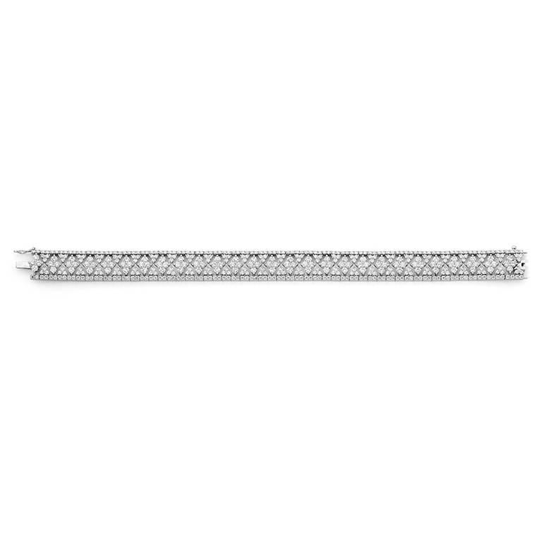 18 Karat white gold Tennis Bracelet set with 486 diamonds = 8.53cts RBC diamonds, 10mm wide cuff 
This item is made to order and will take 6-8 weeks to produce. We can make this item to any of your preferences. 18ct  

Matthew Ely, educated