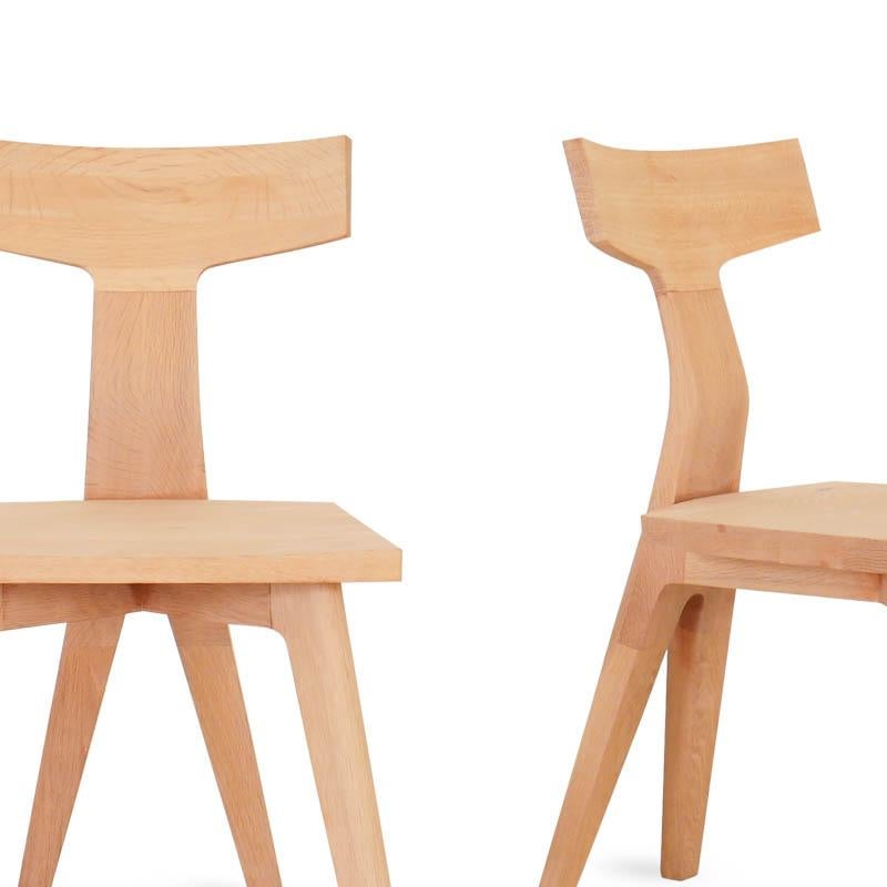 Fin Dining Chair is a sculptural dining chair in solid oak, designed by Matthew Hilton for De La Espada. The chair is carefully constructed and detailed to be equally beautiful from every angle. The backrest highlights inspiration from the sea and