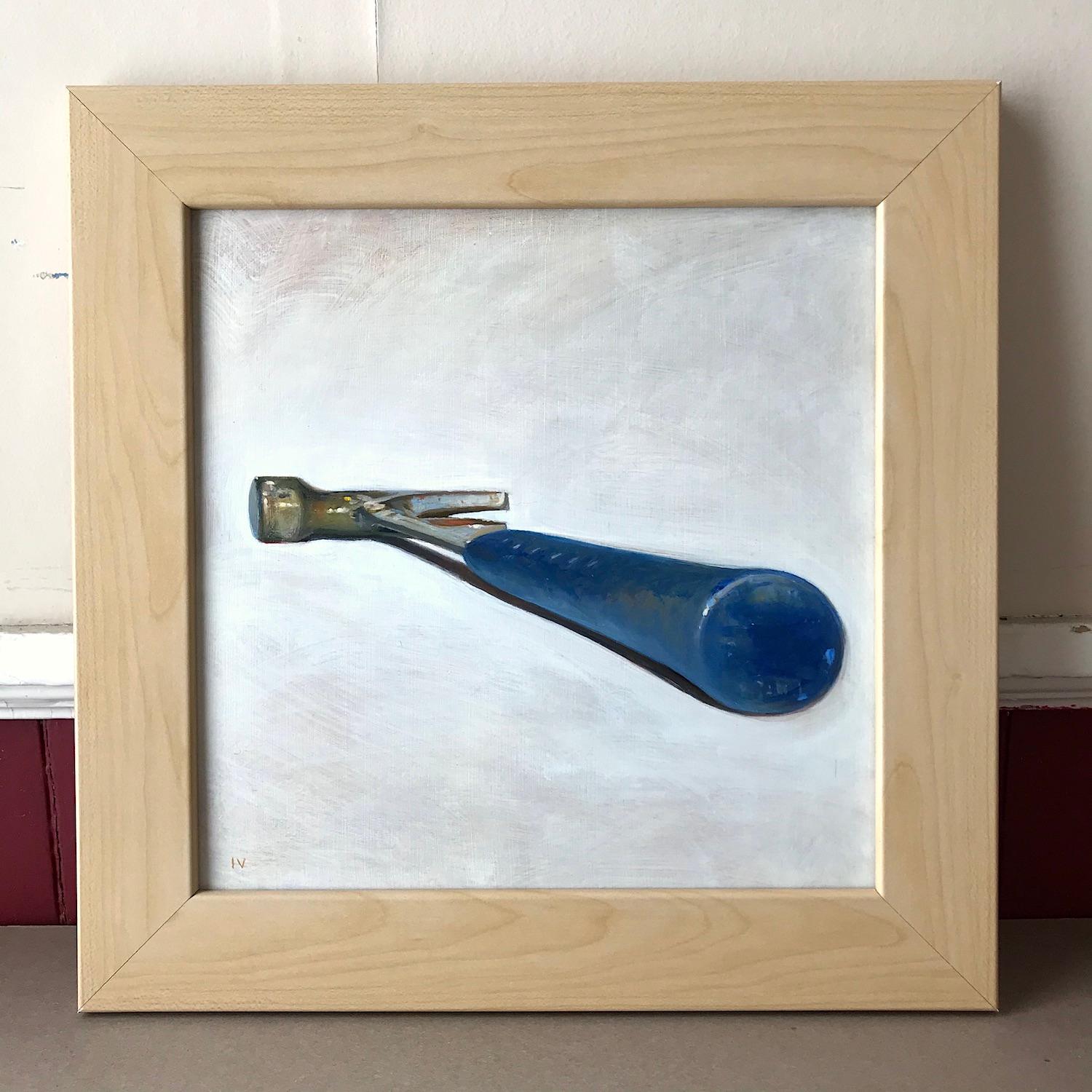 Small, square still life oil painting of a blue hammer against a cream colored backdrop
oil on panel, framed in a light wood frame
12 x 12 inches, 15 x 15 inches framed

As part of his 