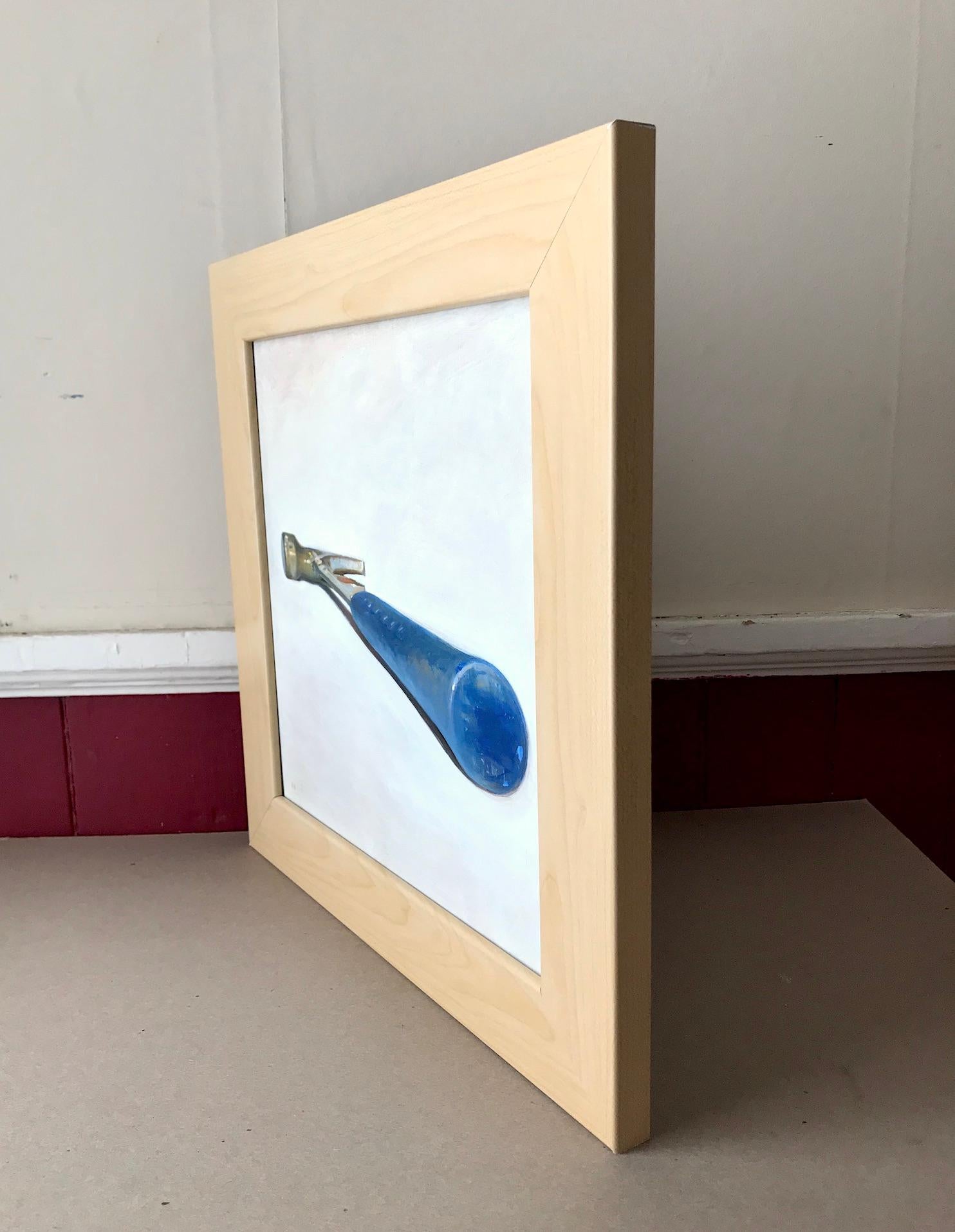 Small, square still life oil painting of a blue hammer against a cream colored backdrop
oil on panel, framed in a light wood frame
12 x 12 inches, 15 x 15 inches framed

As part of his 