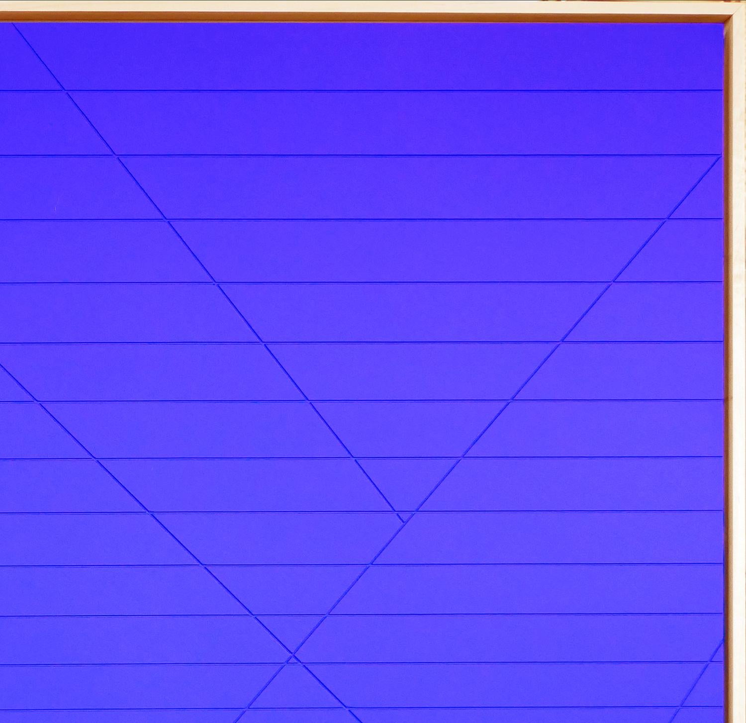 Abstract wall sculpture painting featuring intersecting linear grooves painted with bright blue paint. The uniqueness of this blue does not derive from the ultramarine pigment, but rather from the matte, synthetic resin binder in which the color is