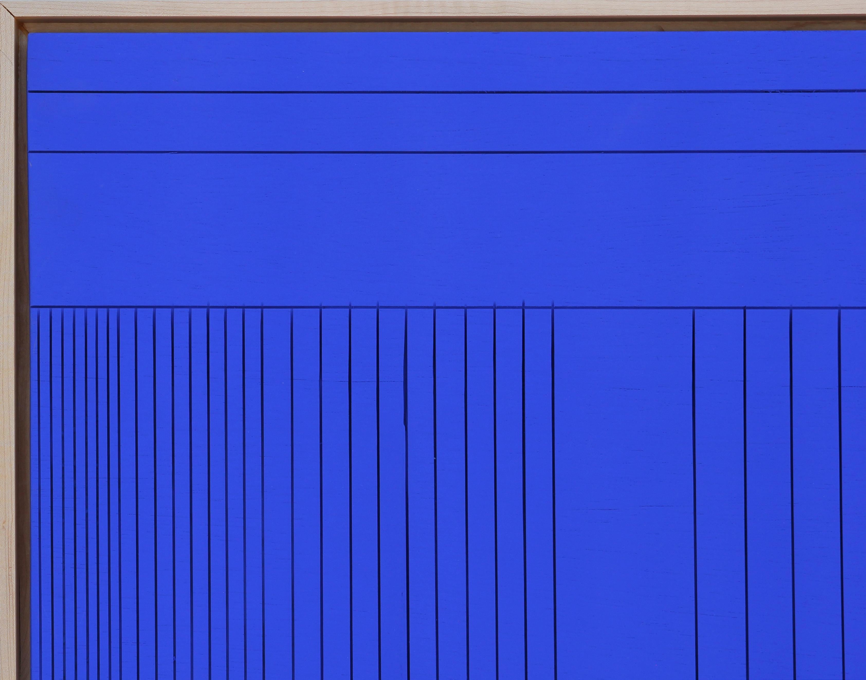 Abstract grooved wall sculpture painted with Yves Klein blue paint. The uniqueness of 