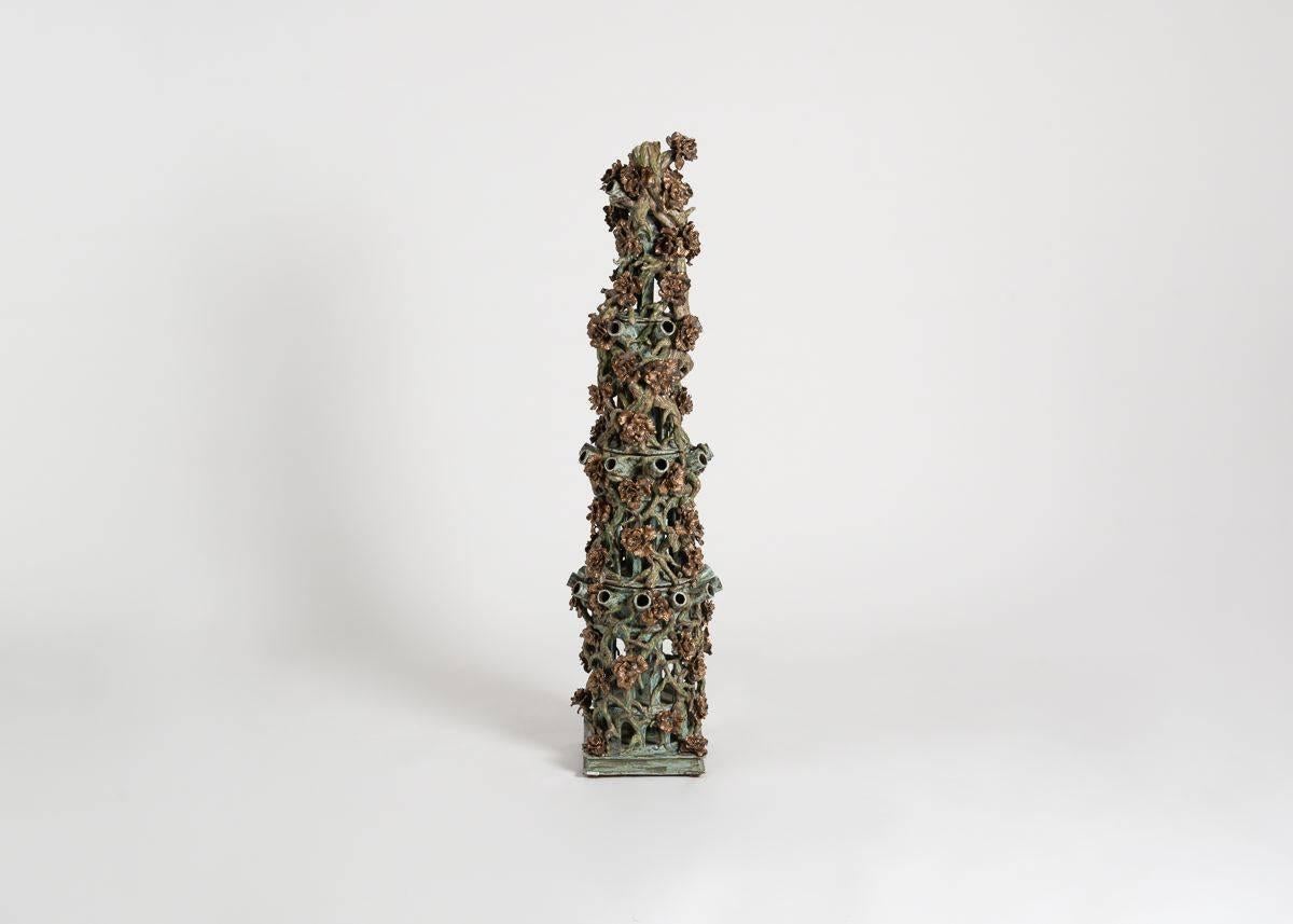 Using fine white porcelain, as well as ceramics fired in a variety of glazes (all of which he crafts himself) Matthew Solomon creates sculptures of beauty with an element of the unexpected. Repetition of form and color creates order within the