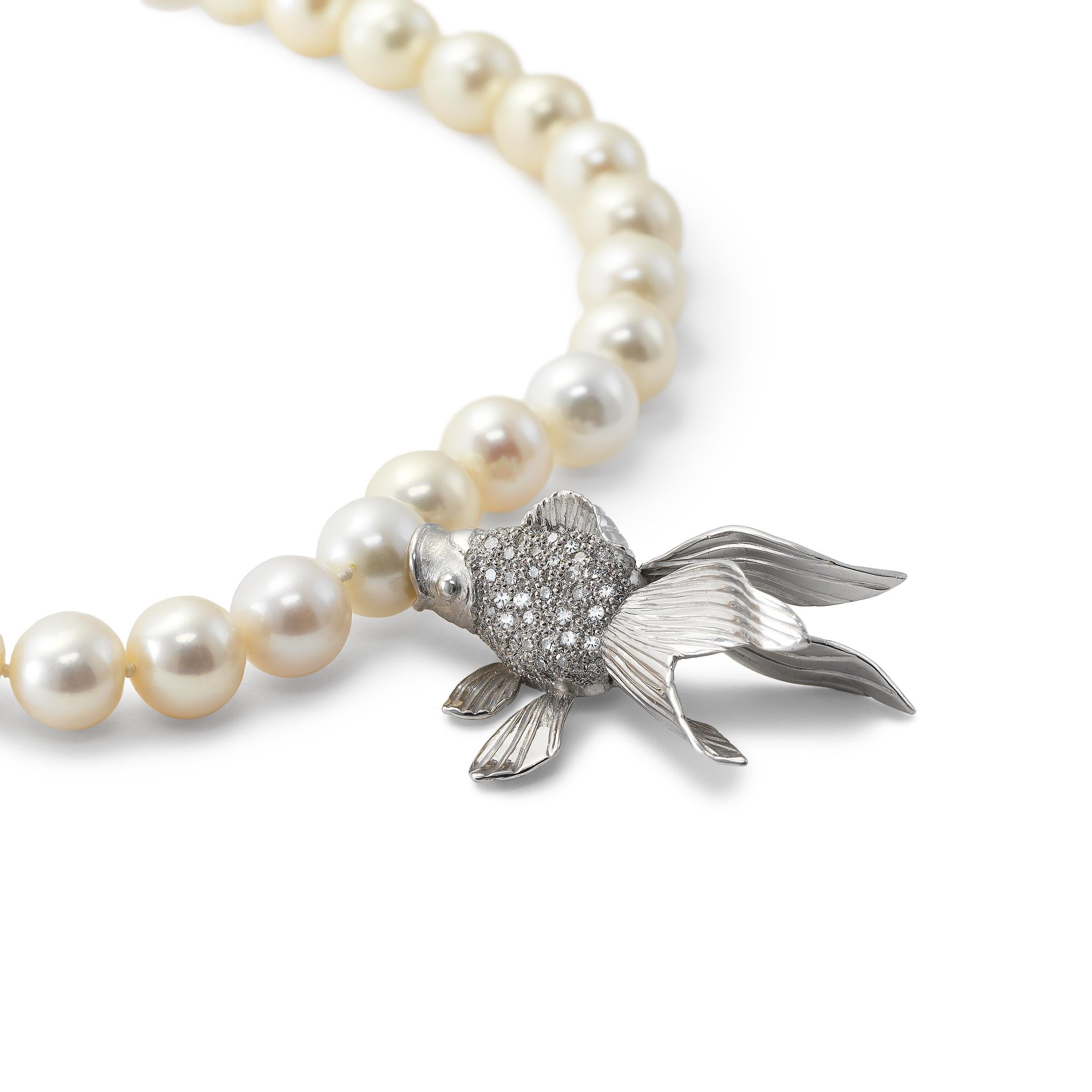 Matthew Trent Platinum and Diamond Koi Fish Pendant suspending from a strand of Pearls.  14K White Gold and Diamond Clasp.   Pendant Stamped Trent Plat and clasp stamped 14K.  Koi Fish Screws on and off Pearl in Innovative Design.  Very Matthew