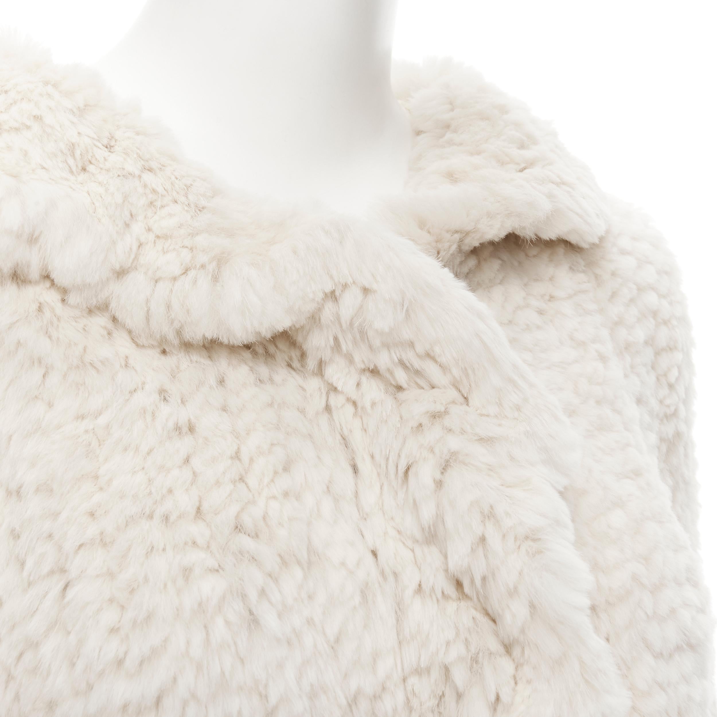 MATTHEW WILLIAMSON beige rabbit fur ruffle collar 3/4 sleeve short jacket UK8 XS 
Reference: CELG/A00074 
Brand: Matthew Williamson 
Designer: Matthew Williamson 
Material: Fur 
Color: Beige 
Pattern: Solid 
Closure: Hook & Eye 
Extra Detail: Draped