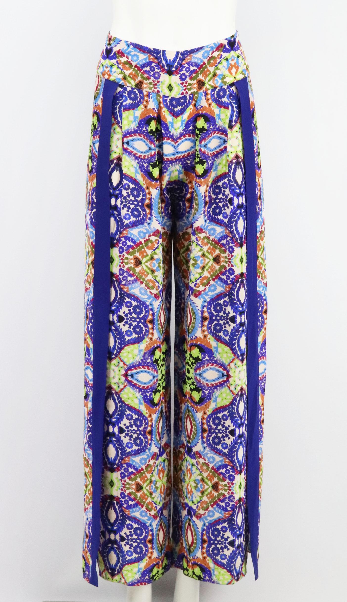 These pants by Matthew Williamson Escape are suitable for both after-dark dinners and adding a joyful print to your beach look, they're made from lustrous silk and have high side splits further the fluidity of the wide legs.
Multicoloured