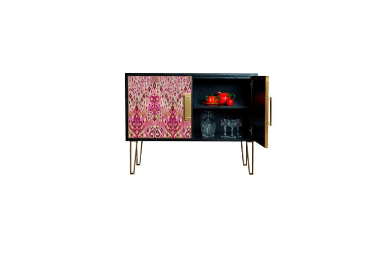 Fine upholstered in Matthew Williamson’s striking Ikat Animal print, the Betty sideboard is a smaller alternative to our Blake and combines luxurious design with a more compact frame.

Handcrafted in England from lacquered oak wood veneers, this