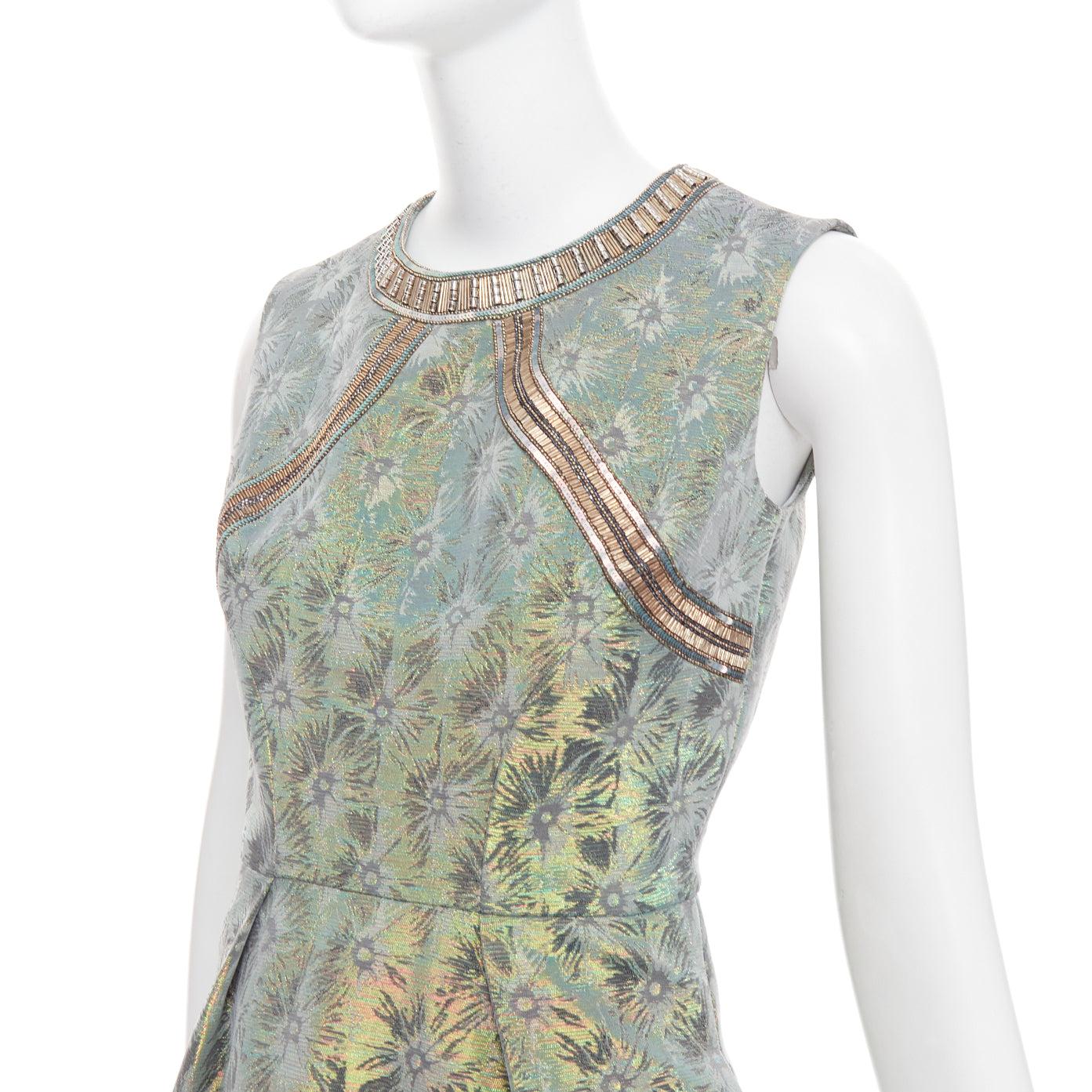 MATTHEW WILLIAMSON green iridescent gold bullet bead sheath dress UK8 S
Reference: CC/A00460
Brand: Matthew Williamson
Model: 907252464
Material: Acetate, Blend
Color: Green, Gold
Pattern: Brocade
Closure: Zip
Lining: Grey Fabric
Extra Details: