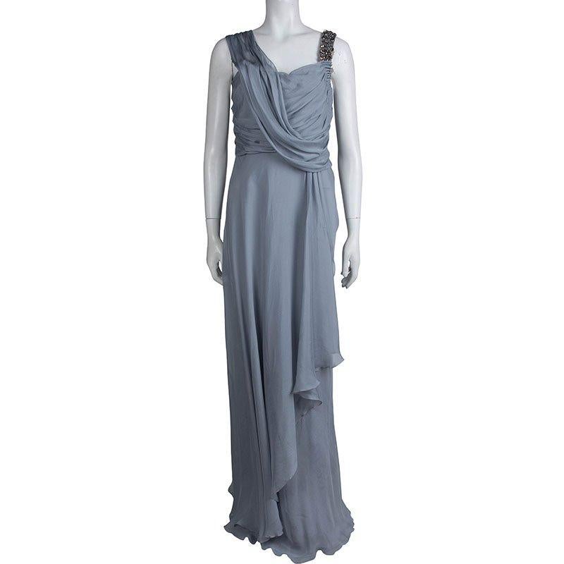 To look instantly elegant for an evening, this draped gown designed by Matthew Williamson is all you need. Crafted in fine silk fabric, this asymmetric gown has a feminine elegance redesigned with a contemporary touch. The embellished strap on one