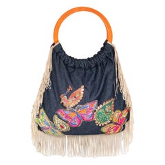 A. Matthewson Borsa a mano con farfalla applicata in denim blu.