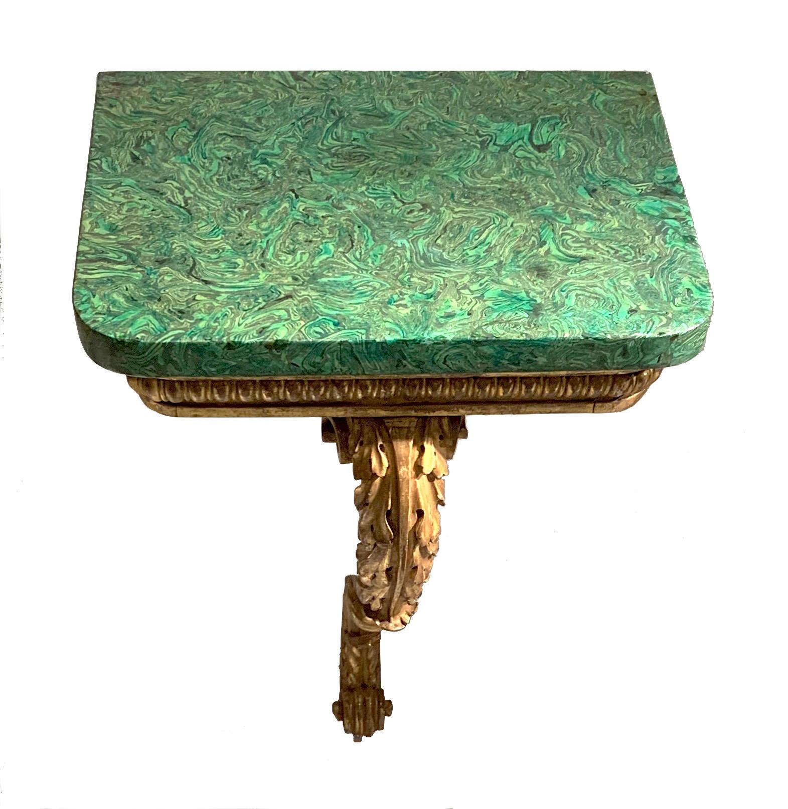 Pair of small console tables - England, circa 1810, Regency - are made out of finely carved and gilt beechwood. The tops are made in Scagliola technique and painted like malachite. 
They are signed 'F. Matthews Ann Street Brighton'.
Size table