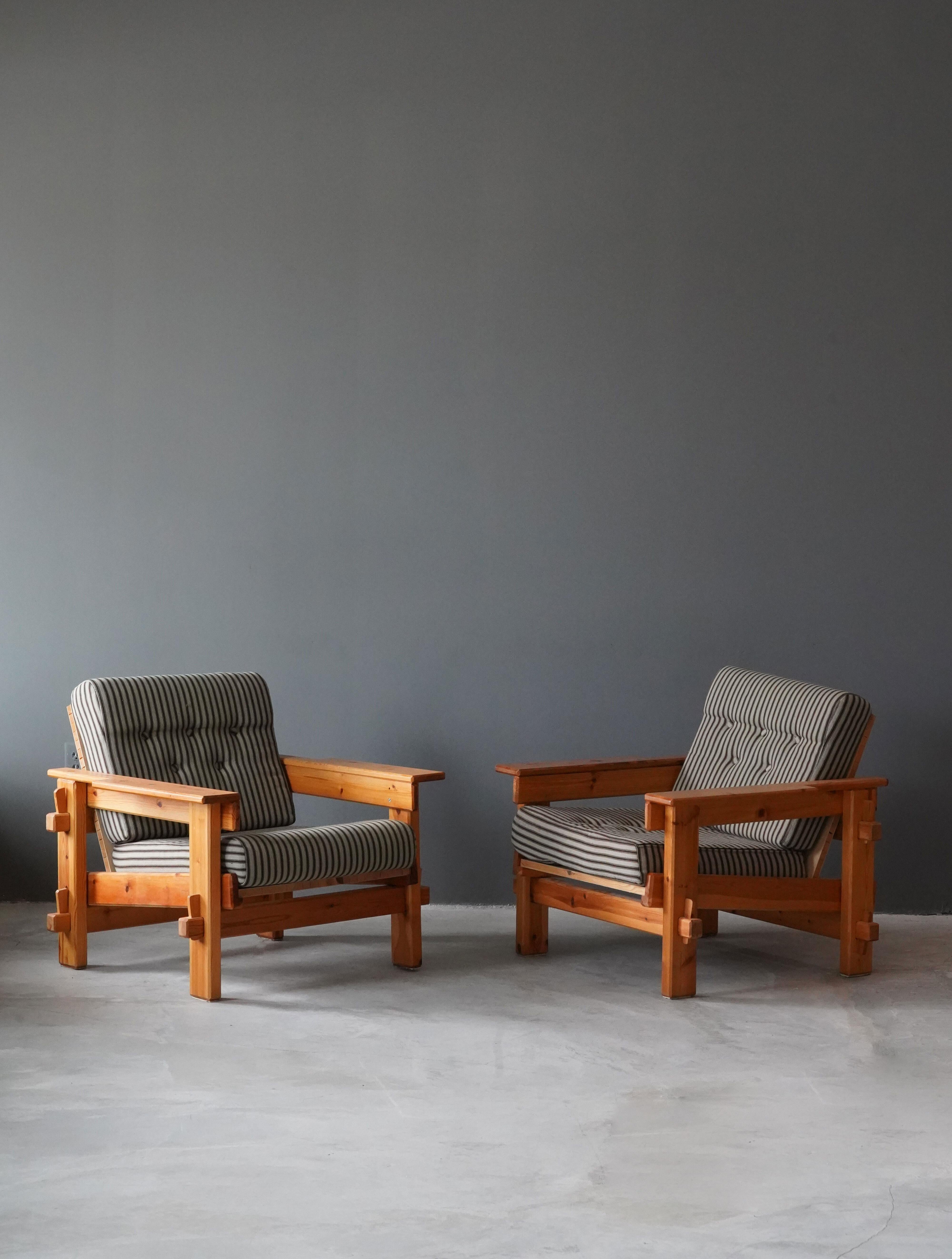 A pair of custom made lounge chairs, designed and produced by Matti Suuronen, Artist's Studio, Finland, 1984.

In highly functional style with revealed joinery. Features it's original 