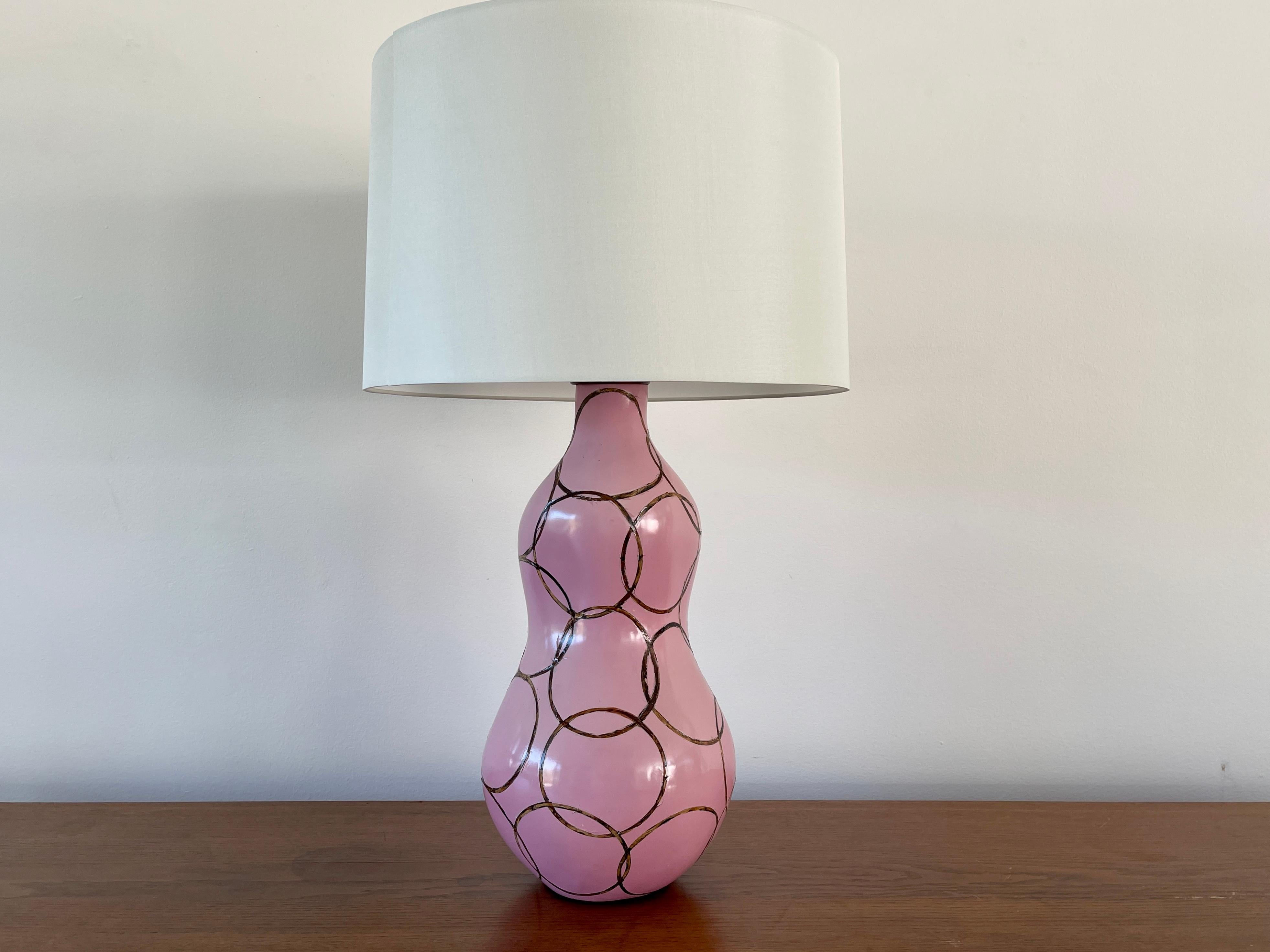 Stunning pink ceramic lamp by Mattia Bonetti (signed) 
Beautiful hourglass shape with wood circles inlaid within fiberglass
Newly rewired with new silk shades. 


Shade - 18 1/2