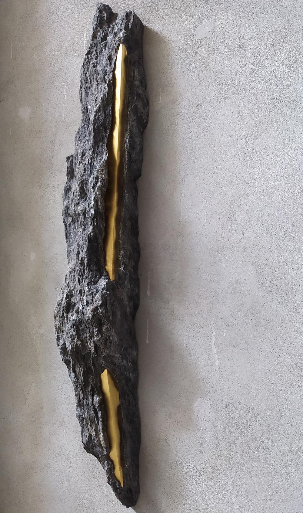 Sezione Aurea - A13 is a wall sculpture by Italian contemporary artist Mattia Bosco.
Palissandro marble and gold leaf, 82.5 cm × 15 cm × 9.5 cm. Unique work.
In his contemporary sculpture, Italian artist Mattia Bosco seeks to create a synthesis
