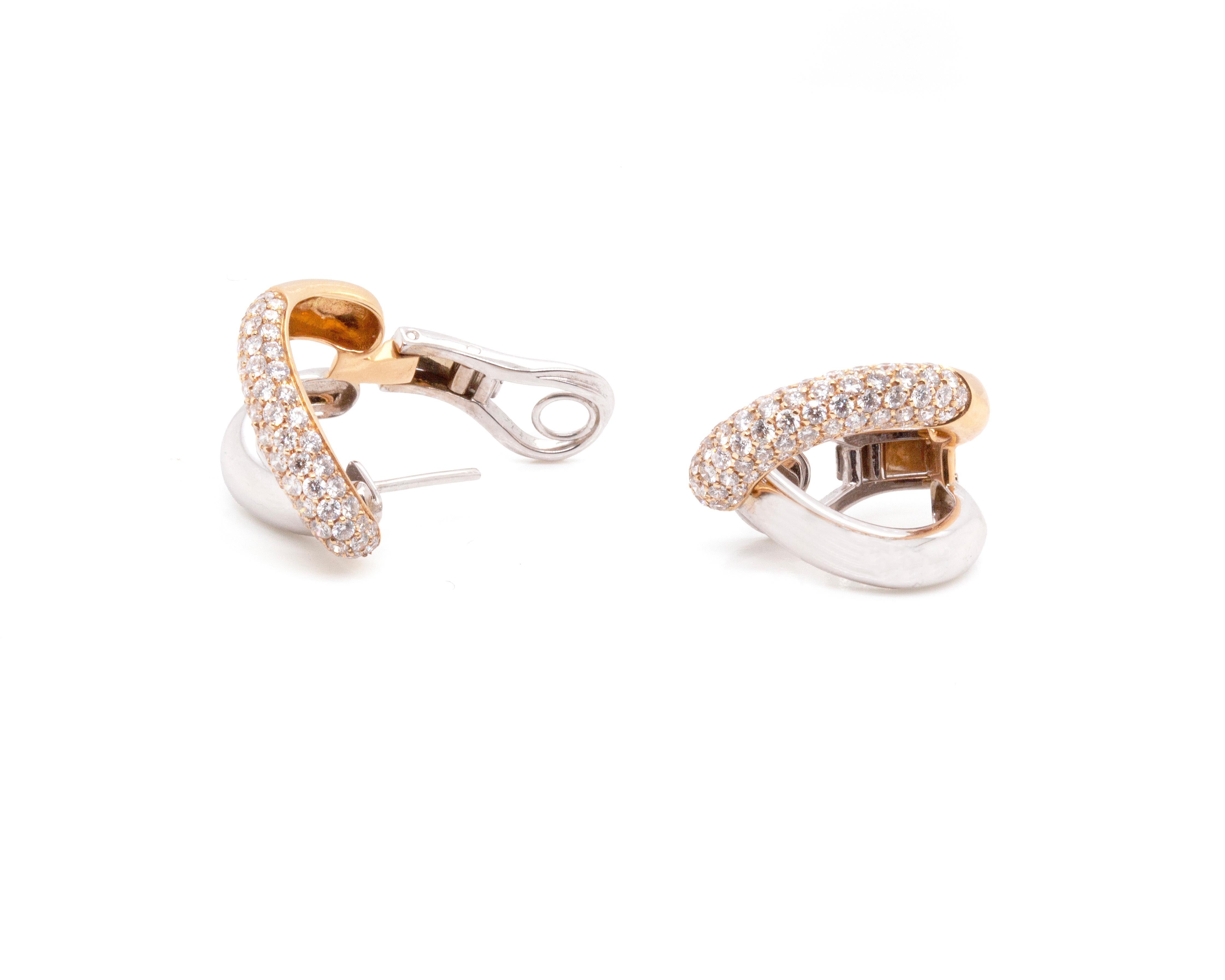These wonderful earrings by Italian jeweller, Mattioli, feature a distinctive and elegant split half-hoop design, masterfully crafted from luxurious 18 carat rose and white gold.

The rose gold half of each earring is beautifully inlaid with a