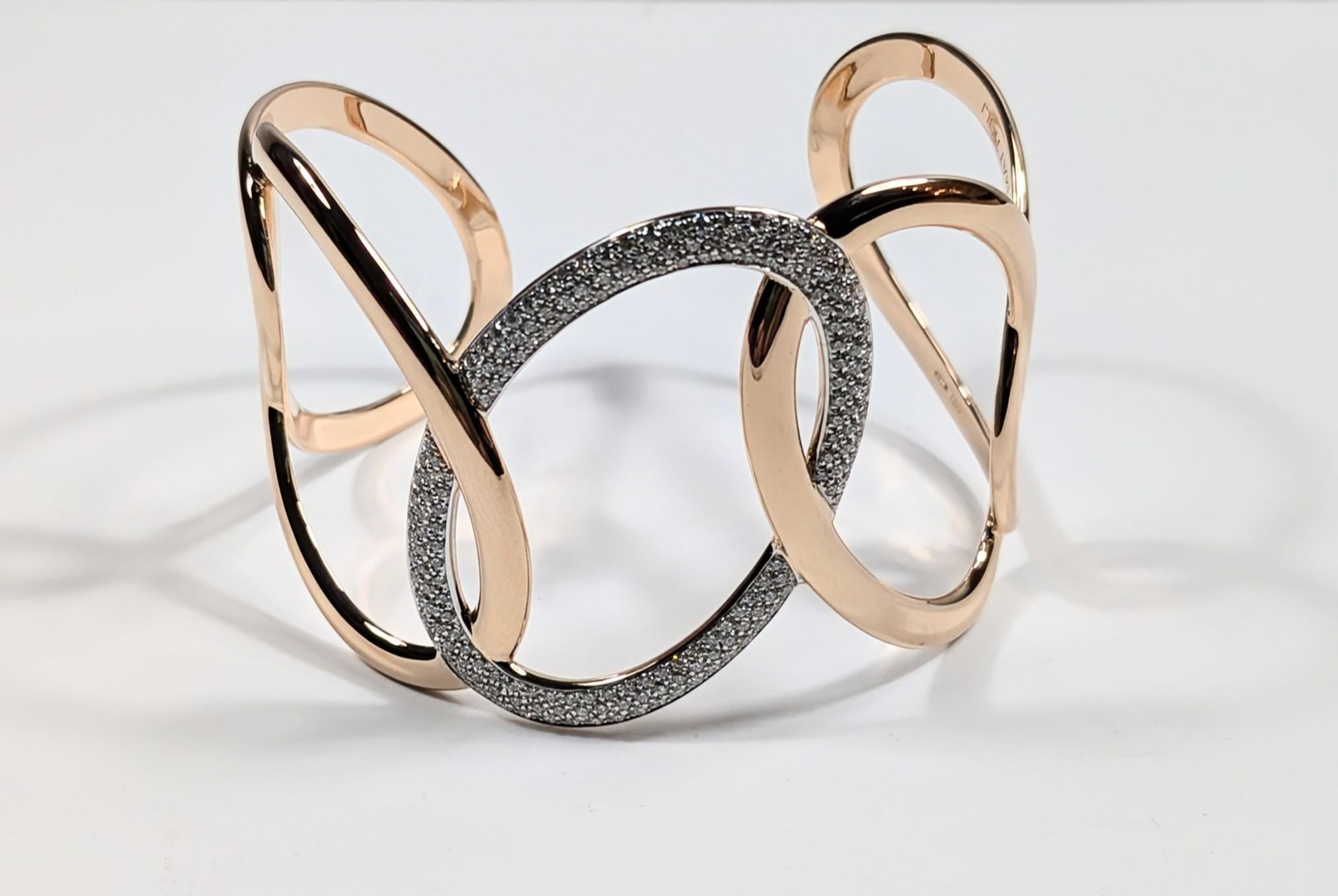 Hiroko cuff in rose gold and white diamonds
Gold Weight gr.: 30
Diamond carats: 1.14ct
Oval width 3cm / 1,18 inches
Sizes Small, Medium and Large
Products available on request in yellow gold or white gold upon feasibility.

READY TO SHIP
*Shipment