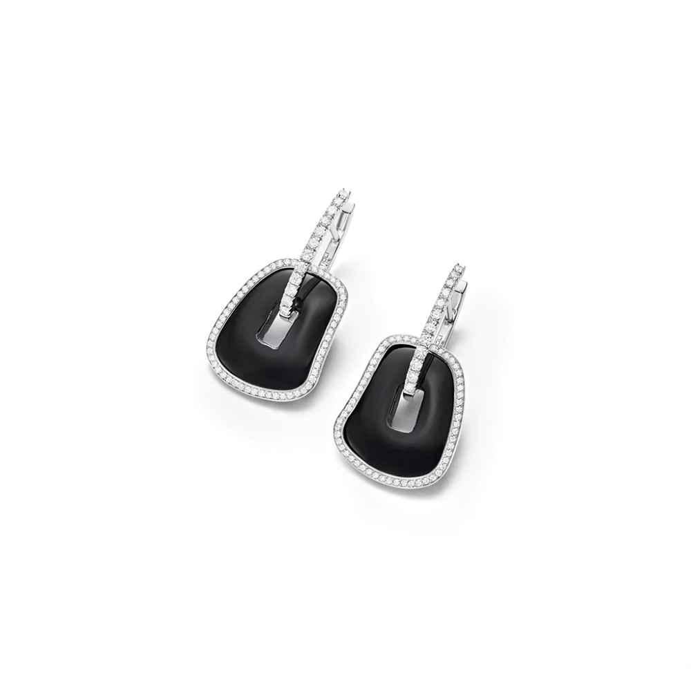 Mattioli Puzzle 18k  White Gold , Black Onyx and White Diamonds Frame Earrings
Diamonds 0,68 carats

If not in stock, production time of thre-four weeks.
Also matching  pendant , necklace and bracelet

Joyful, colourful, whimsical are all defining