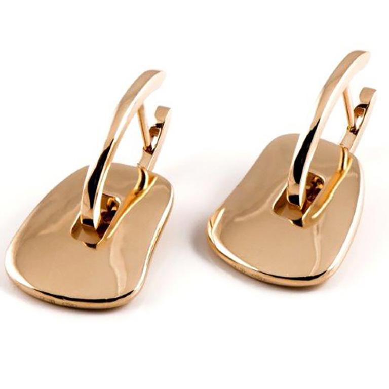 Mattioli Puzzle Collection 18 Karat Rose, White and Yellow Gold Small Size
and three coloured pairs of puzzles to your choice
Measure 15x18 mm / 0,59x0,70 in. 
Gold Weight 09,00gr  
Puzzle pendants of mother of pearl you can choose between 25 colour
