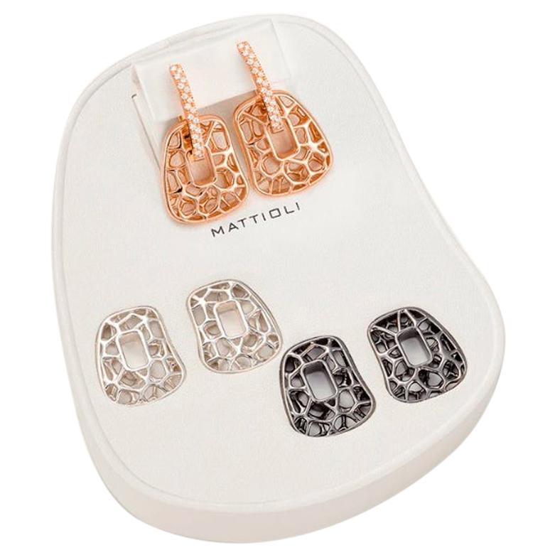 Earrings box in rose gold, white diamonds, silver and bronze Small size 
Diamonds carat 0.34 ct
Weight 10,80gr  
Size pendant 15 x 18mm / 0,59 x 0,70 inches 
Puzzle pendants of mother of pearl you can choose between 25 colour palette 

Important