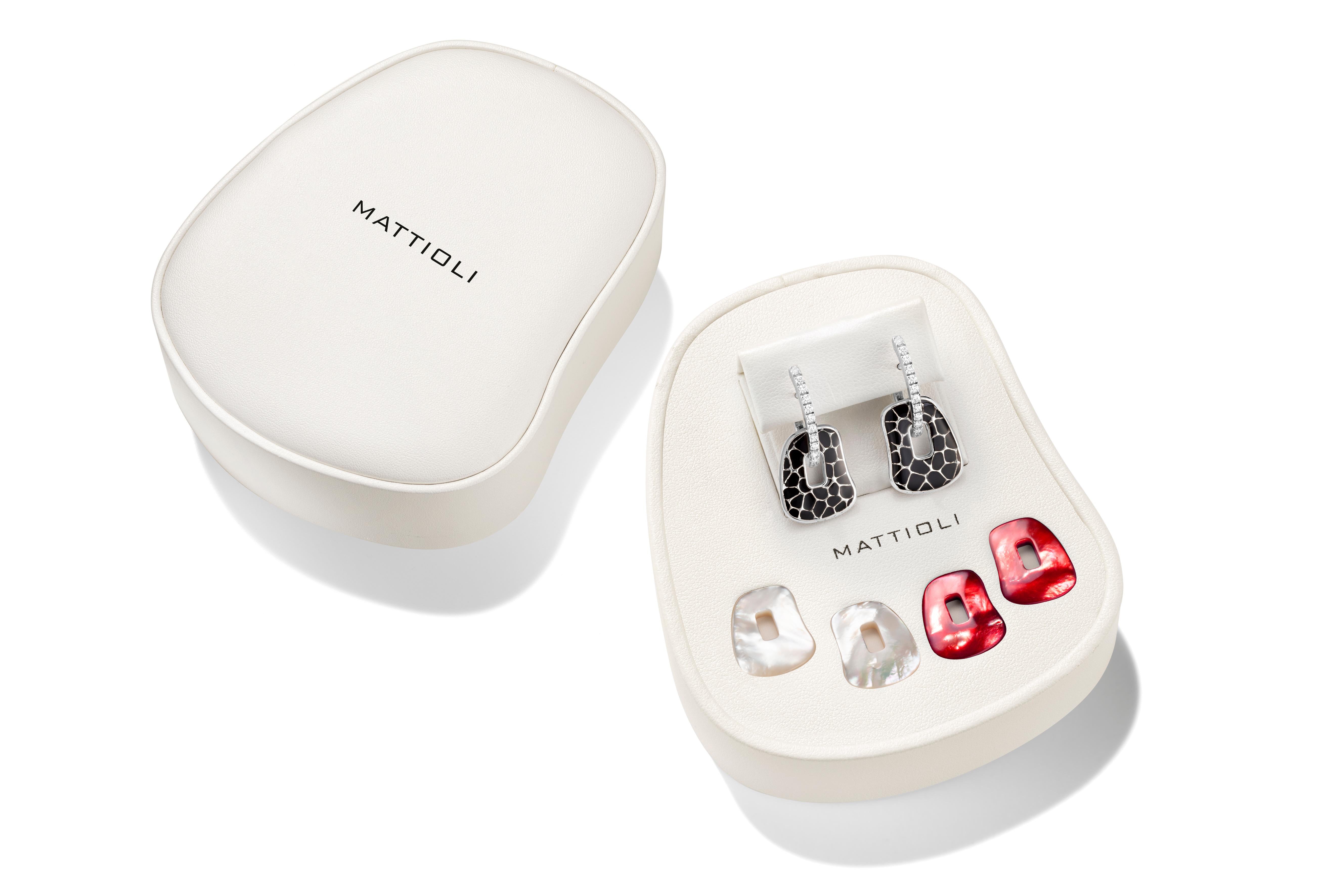Mattioli Puzzle Safari Earrings 18K White Gold Black Enamel White Diamonds Small Size
Weight 10.80 gr 
Measure 15x18mm or 0.60x0.70 in
Puzzle pendants of mother of pearl you can choose between 25 colour palette
Also Available in Rose Gold & Brown