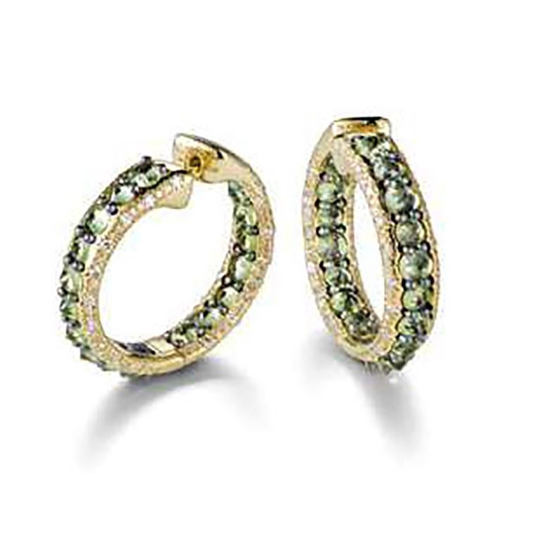 Reve-r collection  a striking visual illusion  created thanks to fancy diamonds, peridots, amethysts, sapphires, rhodolites, and other colourful gems masterly set upside down in yellow or white 18k gold and titanium resulting in an ironic collection