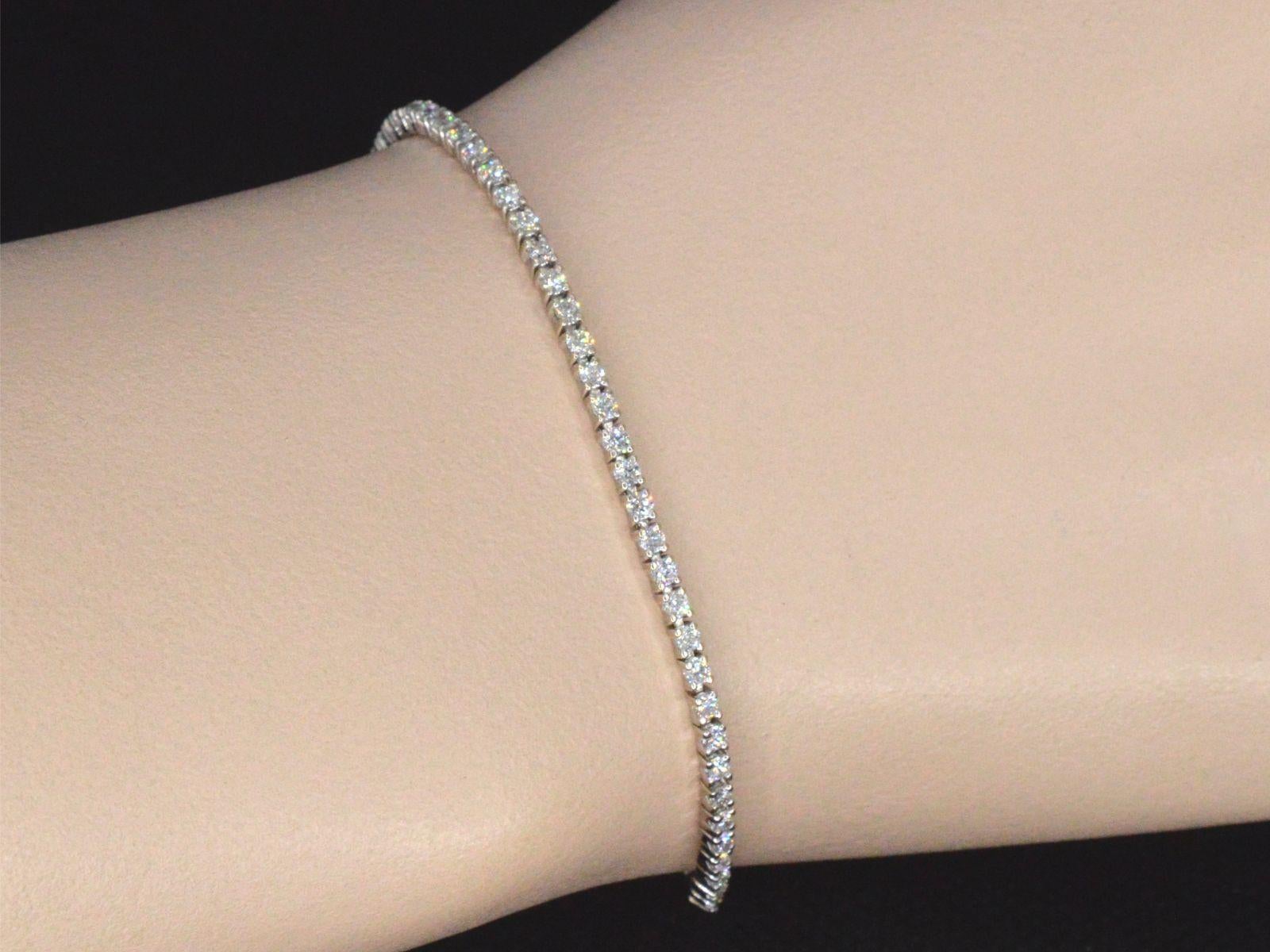 Exquisite Mauboussin white gold tennis bracelet adorned with dazzling diamonds. This stunning bracelet, known as 