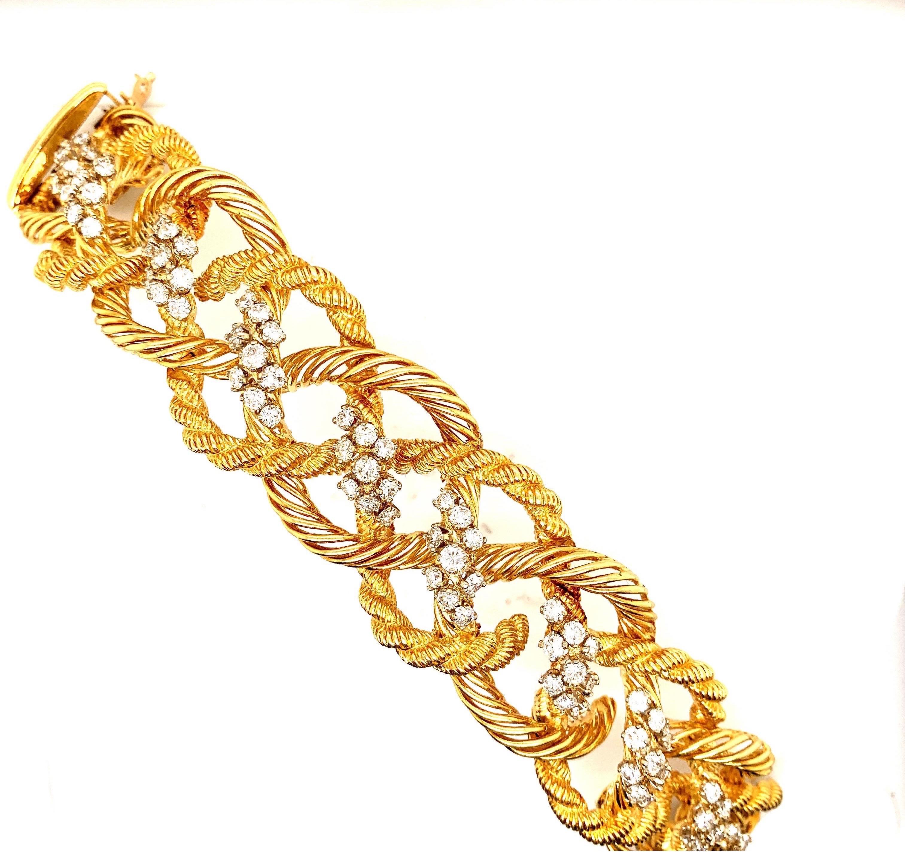 Magnificent “twisted” Rope motif bracelet from famous French designer MAUBOUSSIN featuring approx 9 1/2 carat of near colorless Diamonds of VS clarity. Measuring 7 1/2 inches long and 1 1/4 inches wide. Weighing 124 grams of 18k gold.
With its