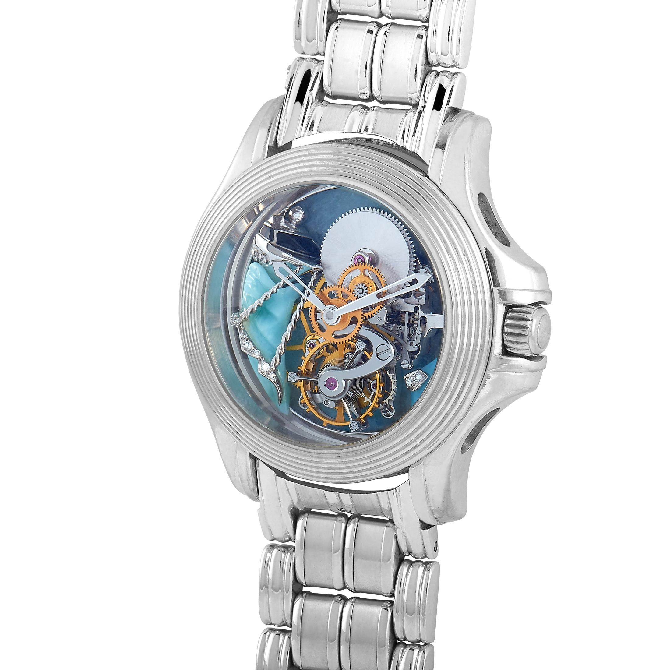 This Mauboussin timepiece boasts a 35 mm 18K white gold case that is presented on a matching 18K white gold bracelet. The watch is equipped with a hand-wound mechanical movement and features central hours and minutes and tourbillon on the