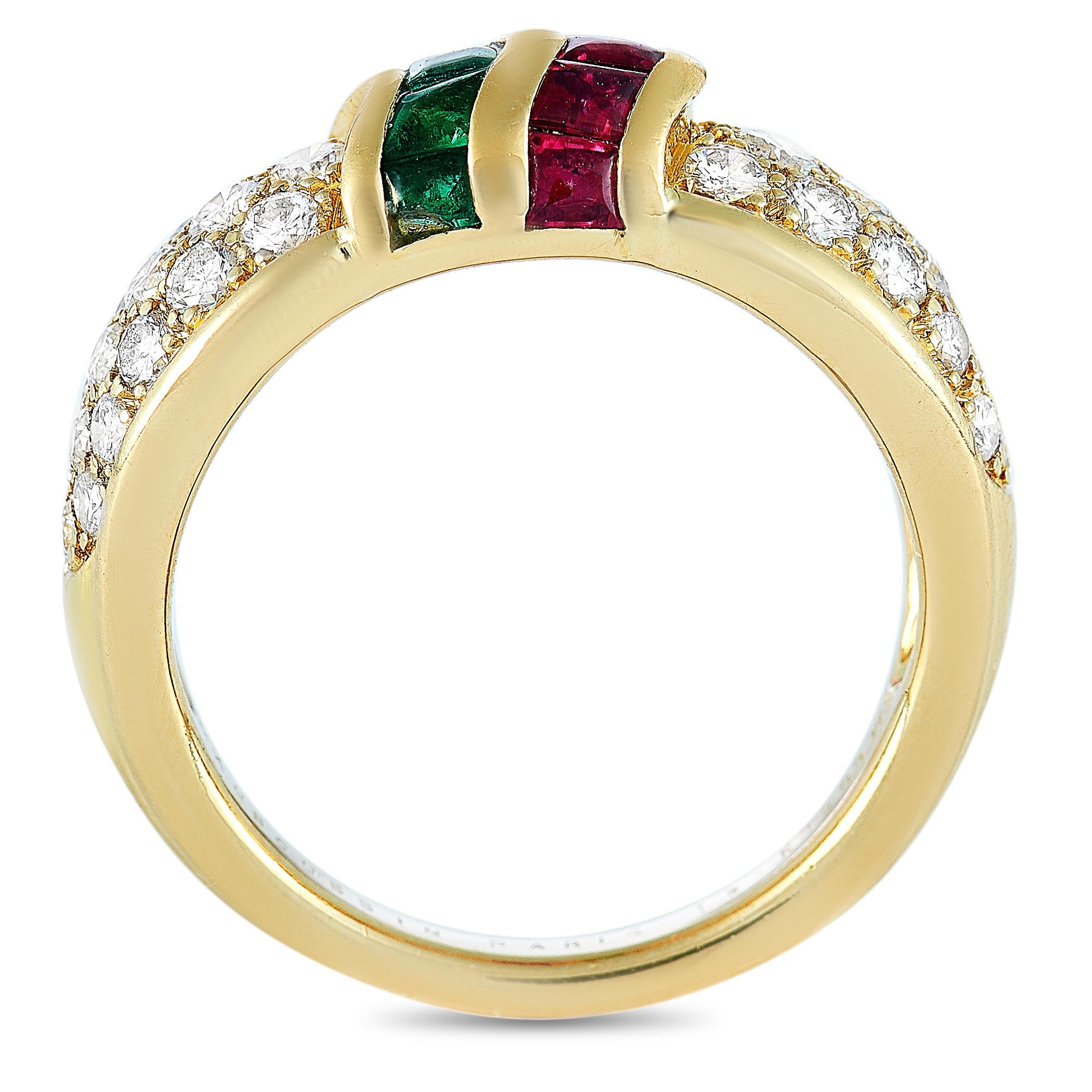 This Mauboussin ring is made of 18K yellow gold and embellished with emeralds, rubies, and a total of 0.45 carats of diamonds. The ring weighs 5.9 grams and boasts band thickness of 3 mm and top height of 4 mm, while top dimensions measure 20 by 7