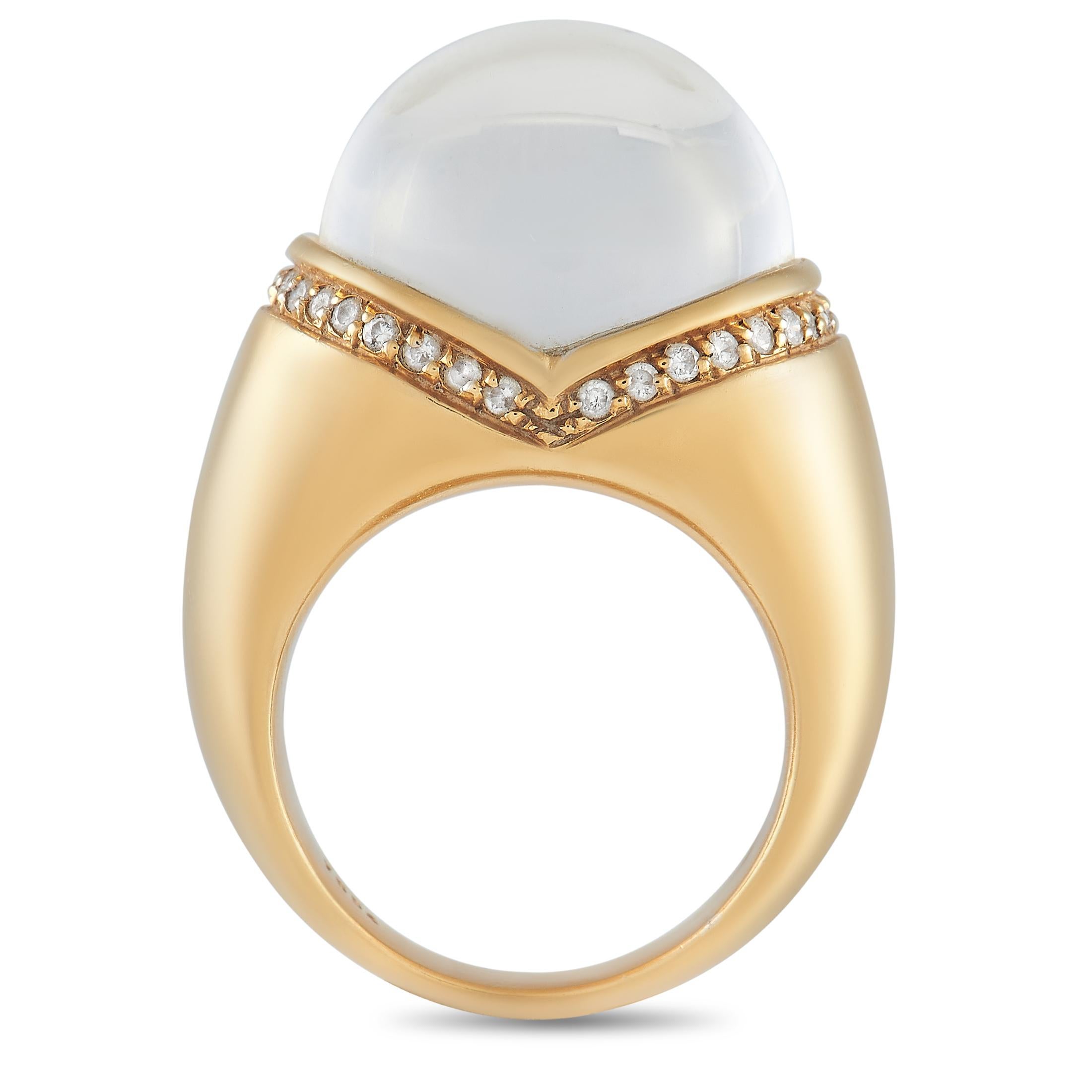 Give your accessorizing game a rocking update with this statement-making piece from Mauboussin. The 7mm thick 18K yellow gold band features a chunky profile with a V-center lined with diamonds and topped with a rock crystal dome. With a 14mm top