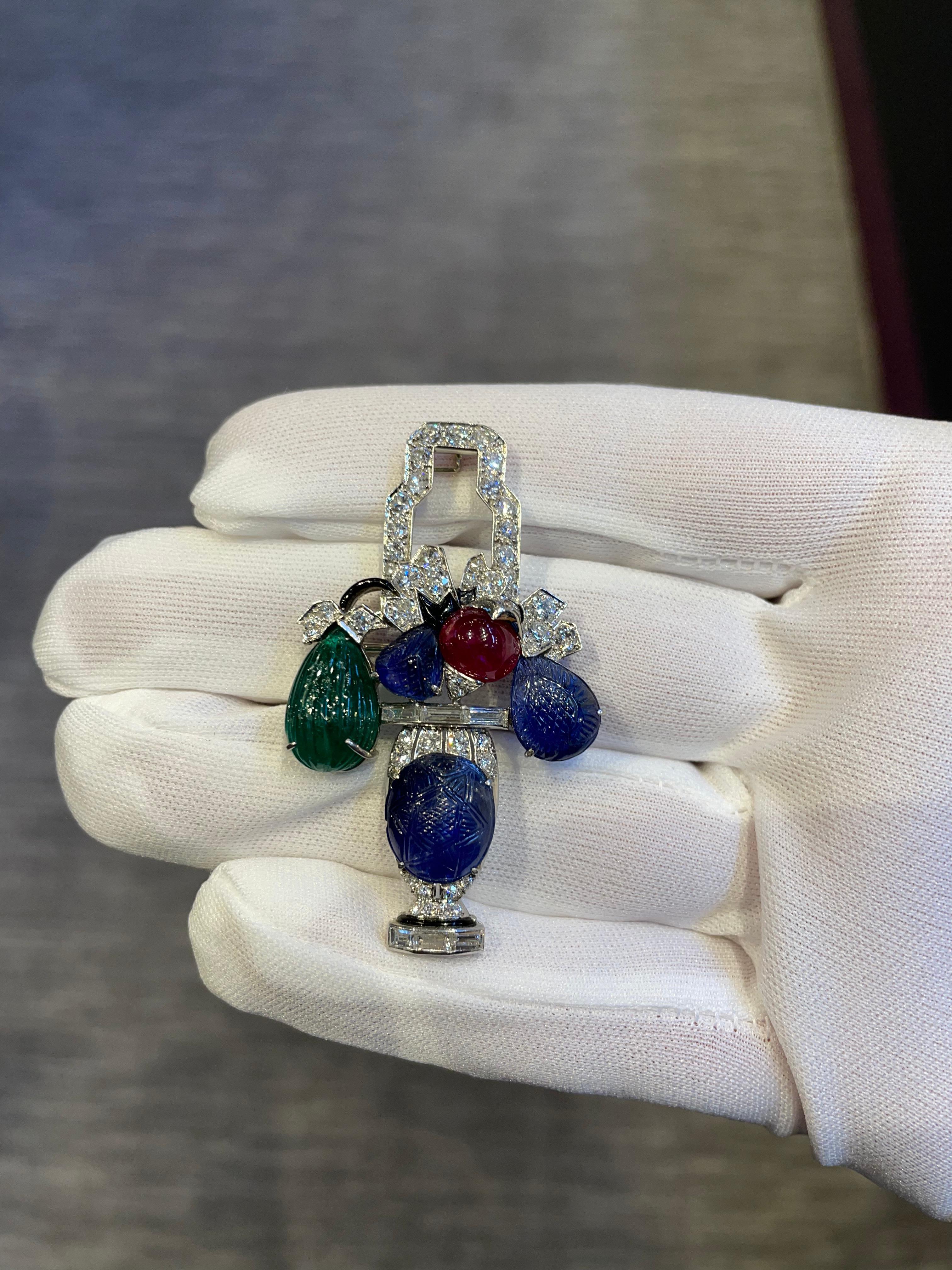 Iconic Mauboussin Art Deco Tutti Frutti Giardinetto Brooch

Set with diamonds, cabochon ruby and carved sapphires and emerald.

Made in France. 1928.

With Certificate of Authenticity issued by Mauboussin
