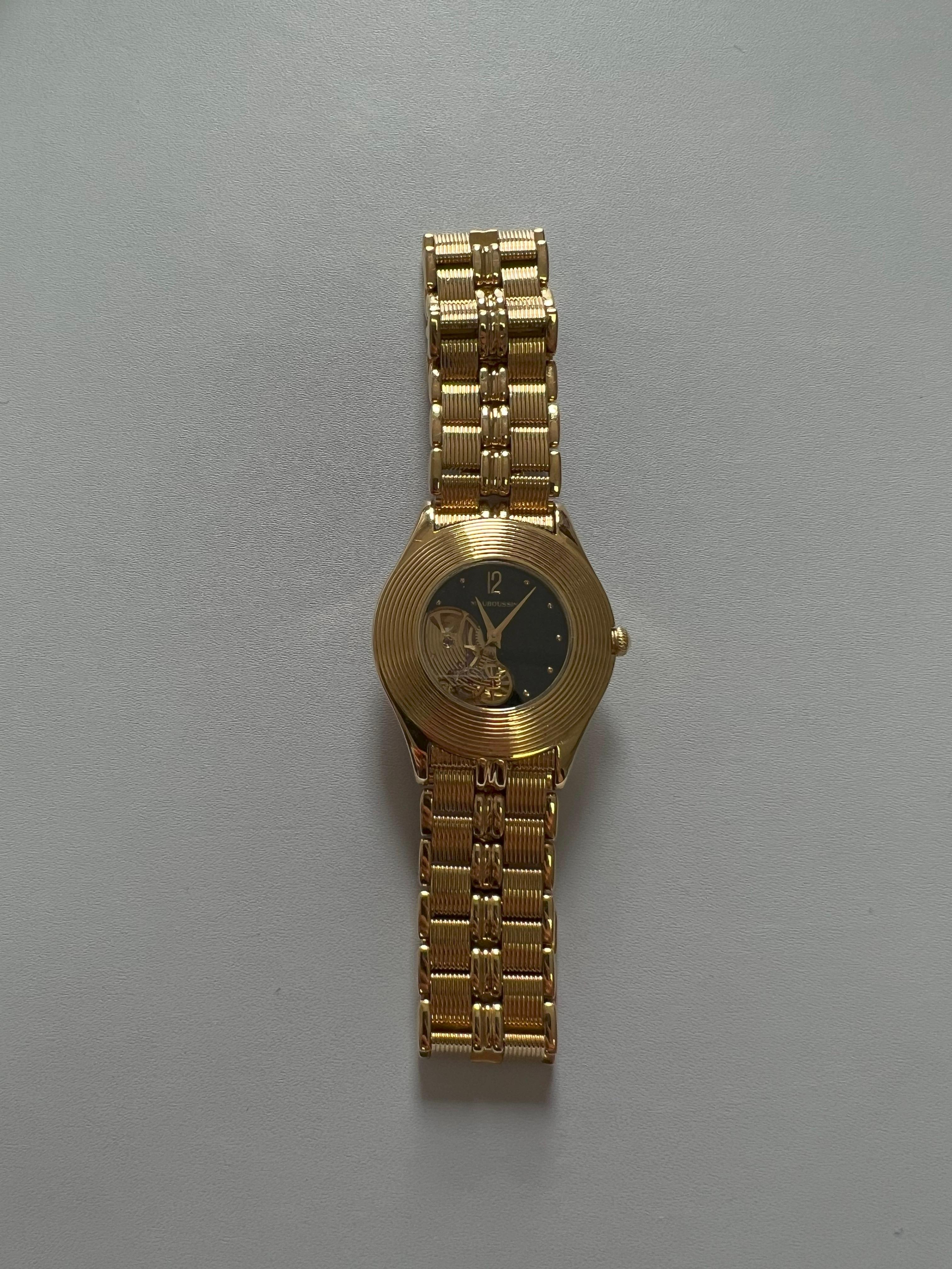 Mauboussin Watch - 18K Yellow Gold - Weight 111.87 Grams - 7.7 inches length - 34mm Dial Diameter - Circa 1990s
Please take a close look at the dial and backside photos for all engravings and hallmarks. 