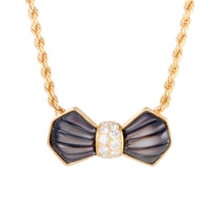 Mauboussin Black Mother-of-Pearl and Diamond Yellow Gold Bow Pendant