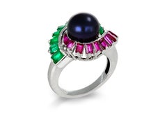 Mauboussin black pearl, ruby and emerald cluster ring, French, 1957.
