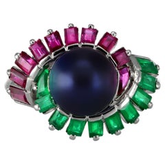 Mauboussin black pearl, ruby and emerald cluster ring, French, 1957.