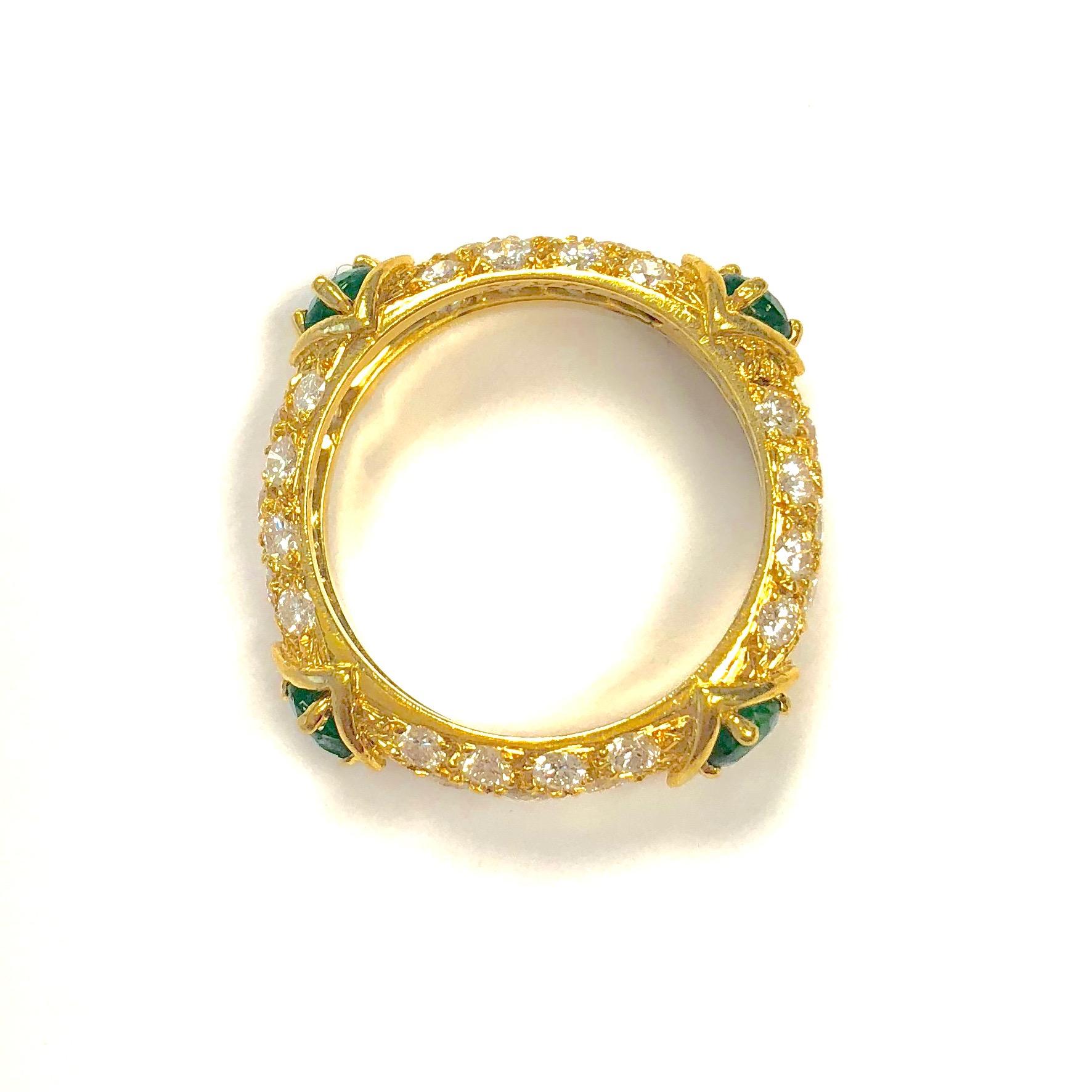 18K yellow gold pave' set diamond band with four emeralds.
Marked: MAUBOUSSIN PARIS and the serial number and the french 18K gold hallmark
Total diamond weight: 1.1 carats
Total emerald weight: 0.60 carats
Size: 6.25
Weight: 4.7 grams 