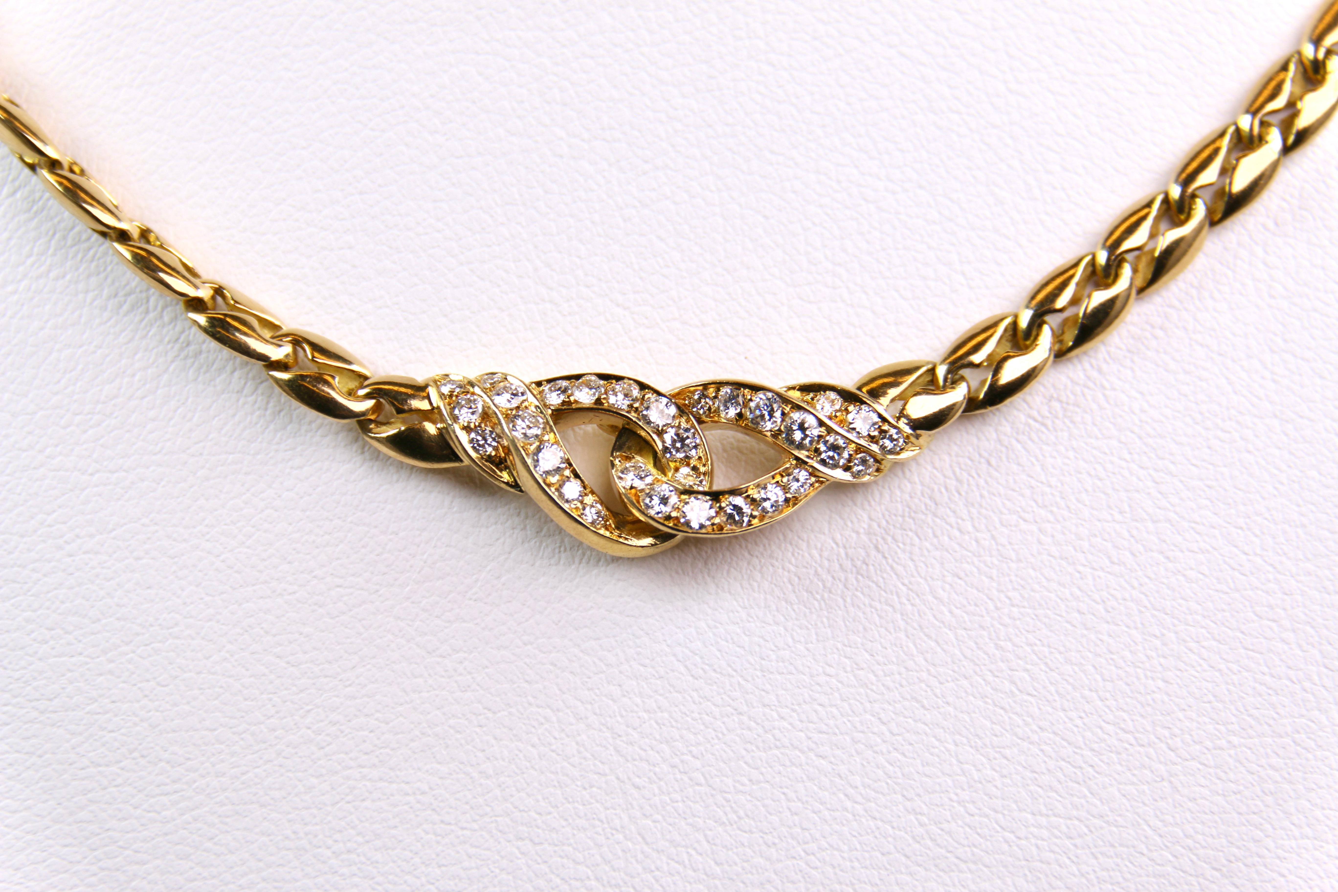 Designer Mauboussin Diamond Choker Necklace in 18 Karat Yellow Gold.  Within this beautiful choker are 30 round diamonds, weighing approximately .90 carats total weight, G in color and VS2 in clarity.  The necklace is 16