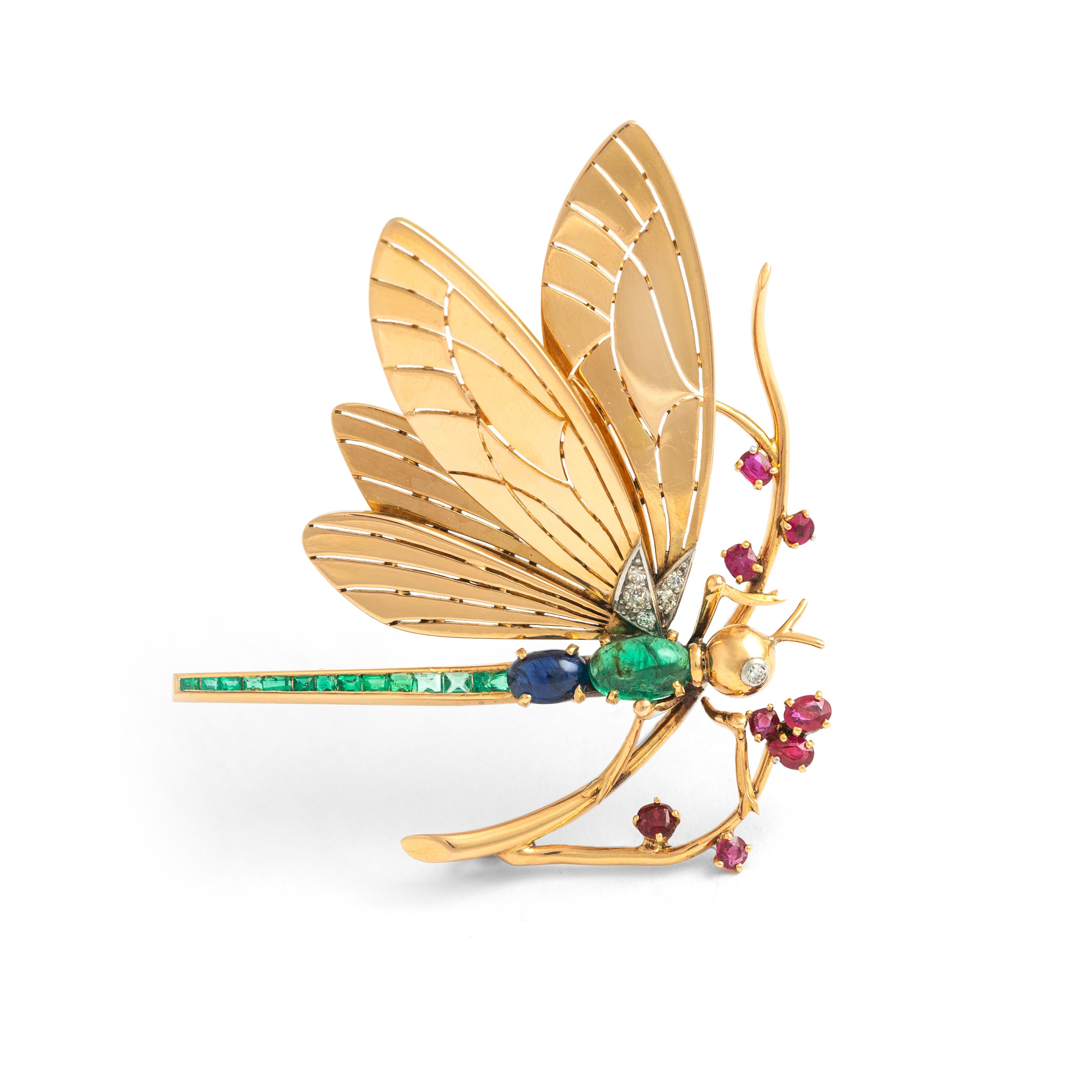 Mauboussin Dragonfly Diamond Emerald Ruby Sapphire Yellow Gold 18K Brooch.
Circa 1940.
Signed Mauboussin.

Dimensions:
Length: 5.10 centimeters.
Height: 7.20 centimeters.
Thickness: approx. 1.50 centimeters.

Weight: 22.88 grams

