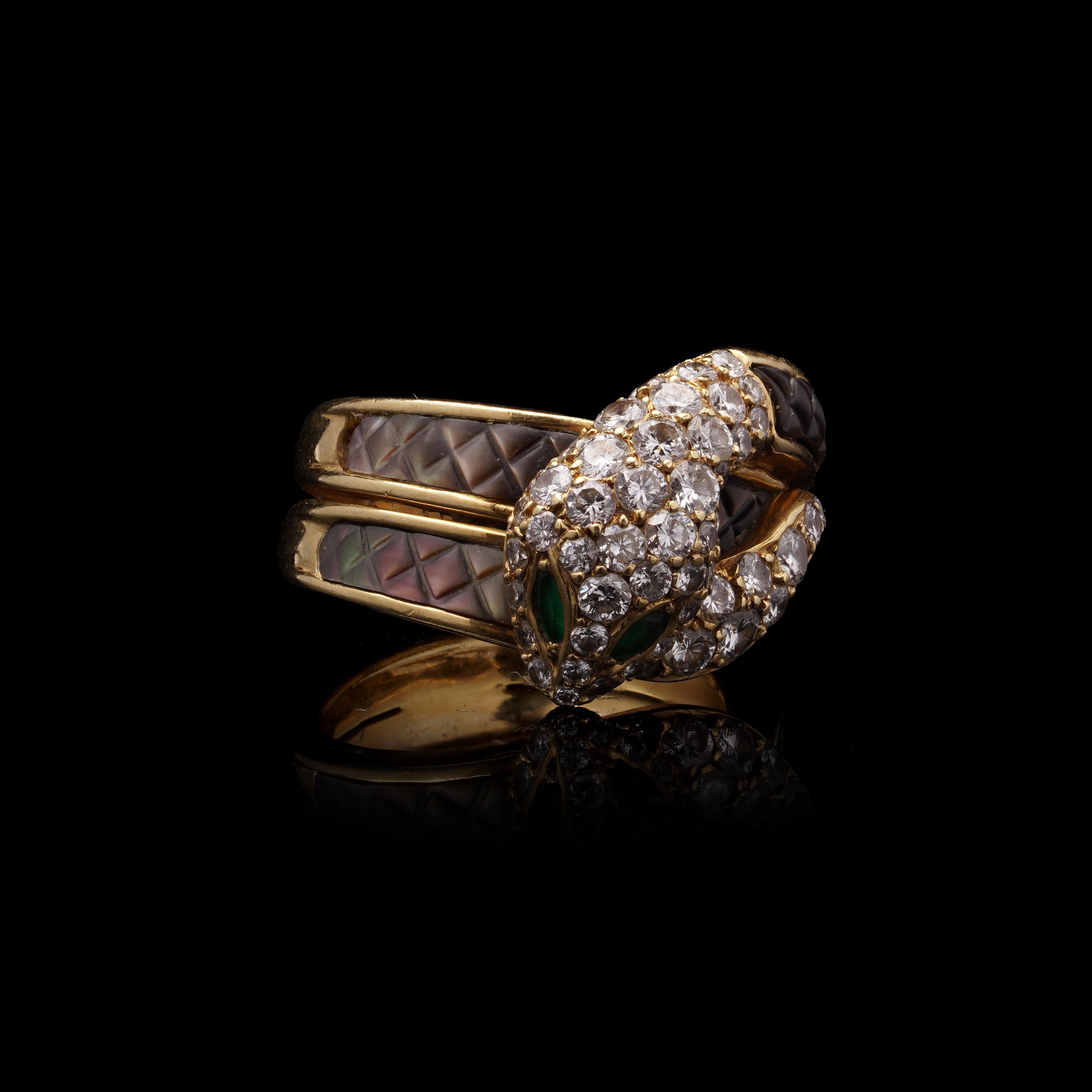 Mauboussin French 18kt Gold Diamond Snake Ring with Emerald Eyes and Mother-of-Pearl Inlay, c. 1950s

A finely crafted vintage snake ring by Mauboussin, one of France’s most respected high jewellers. Made in the 1950s and hallmarked with the French