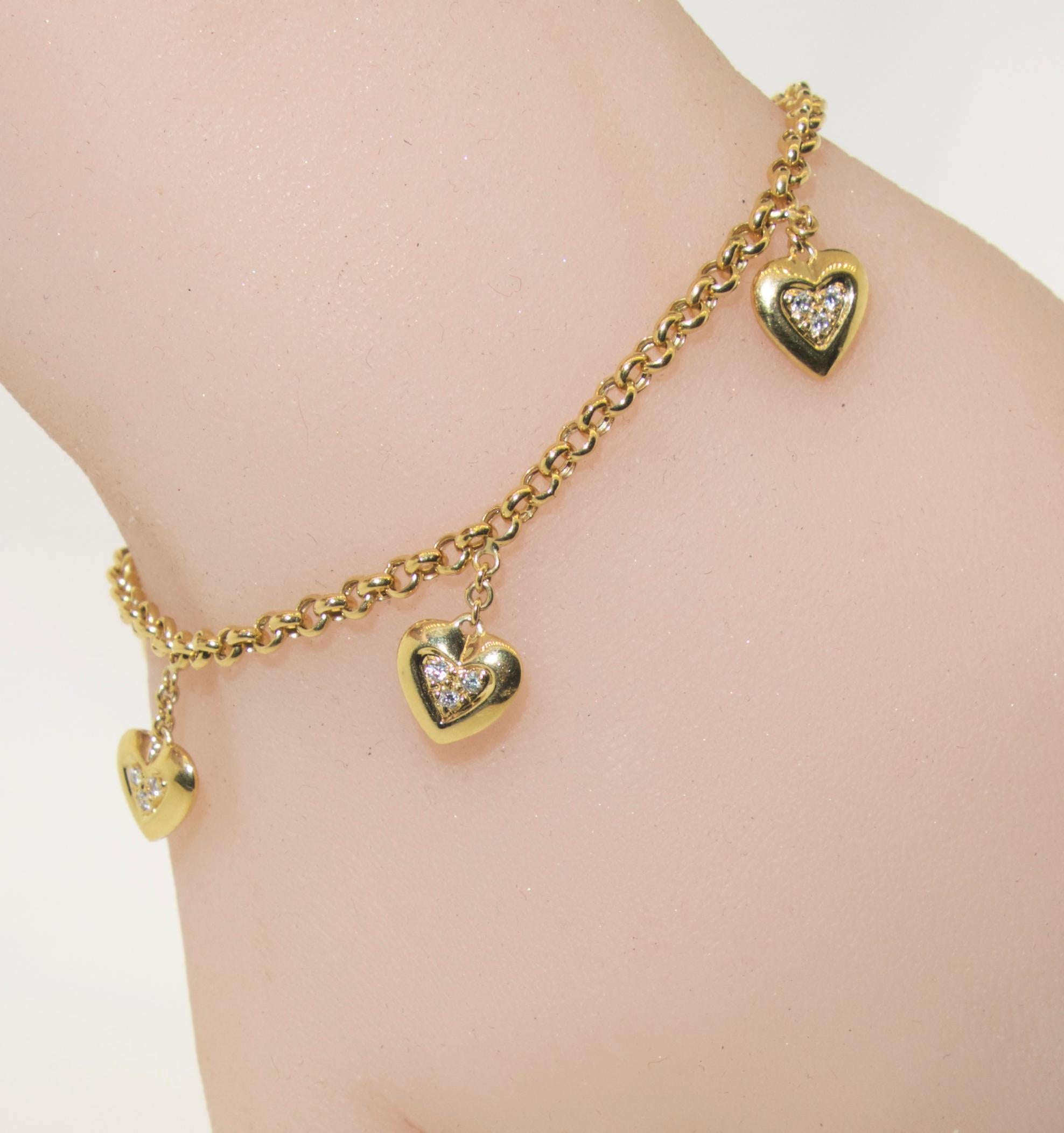 Mauboussin heart bracelet with small diamonds.  Signed and numbered from the  world famous jewelry house of Mauboussin, this charming bracelet has 15 fine white small diamonds set into the hearts.  The bracelet is 7 inches long.