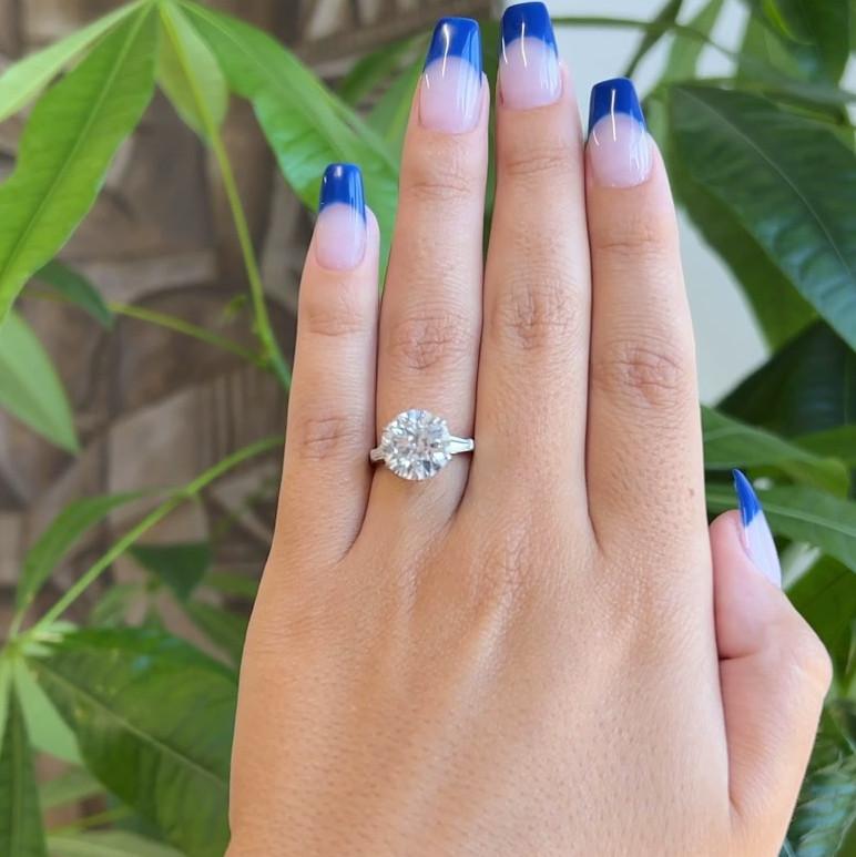 One Mid Century Mauboussin GIA 4.49 Carat Old European Cut Diamond Platinum Engagement Ring. Featuring One GIA old European cut diamond of 4.49 carats, accompanied with certificate #2225462102 stating the diamond is J color, I2 clarity. Accented by