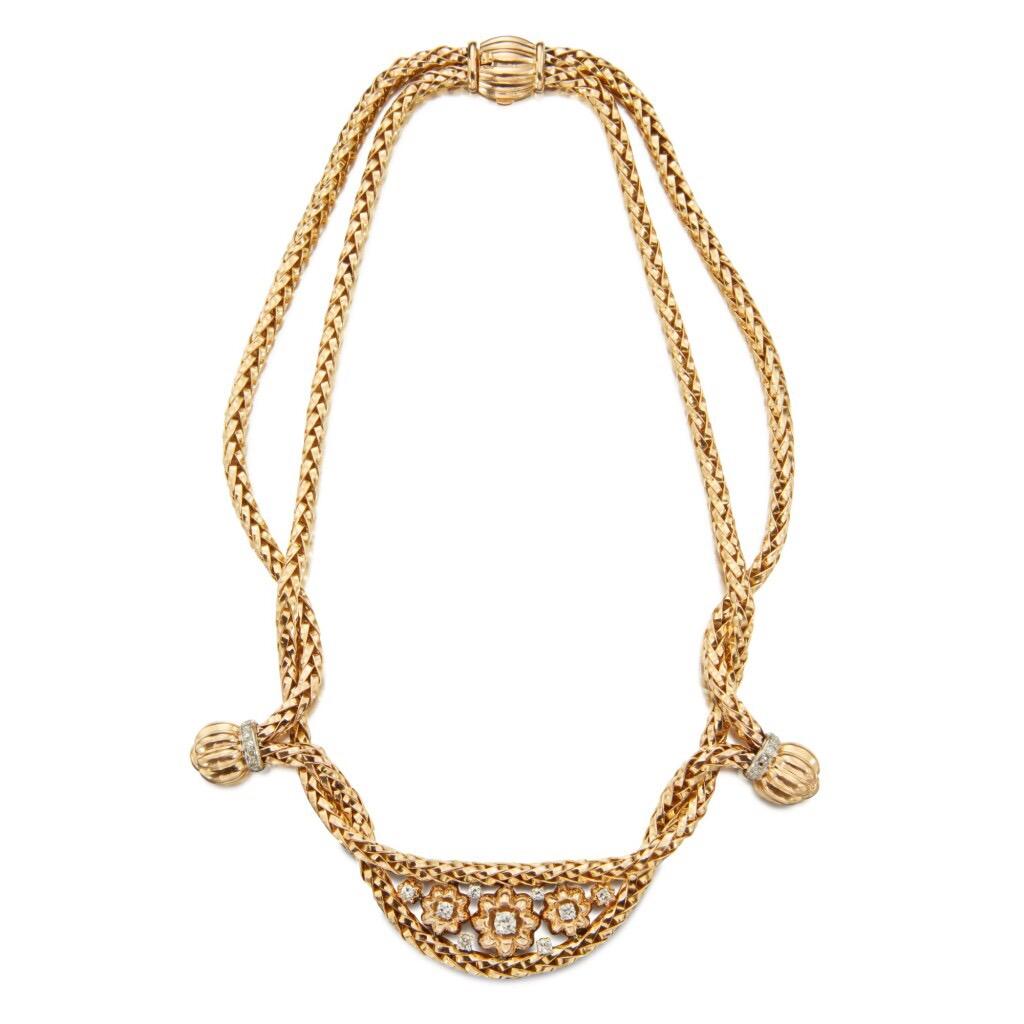 Mauboussin Necklace composed of two strands of intertwined gold rope-twist, the front featuring floral motifs and fluted boules, embellished with old European and single-cut diamonds. Made in France, circa 1940

Diamonds weighing a total of