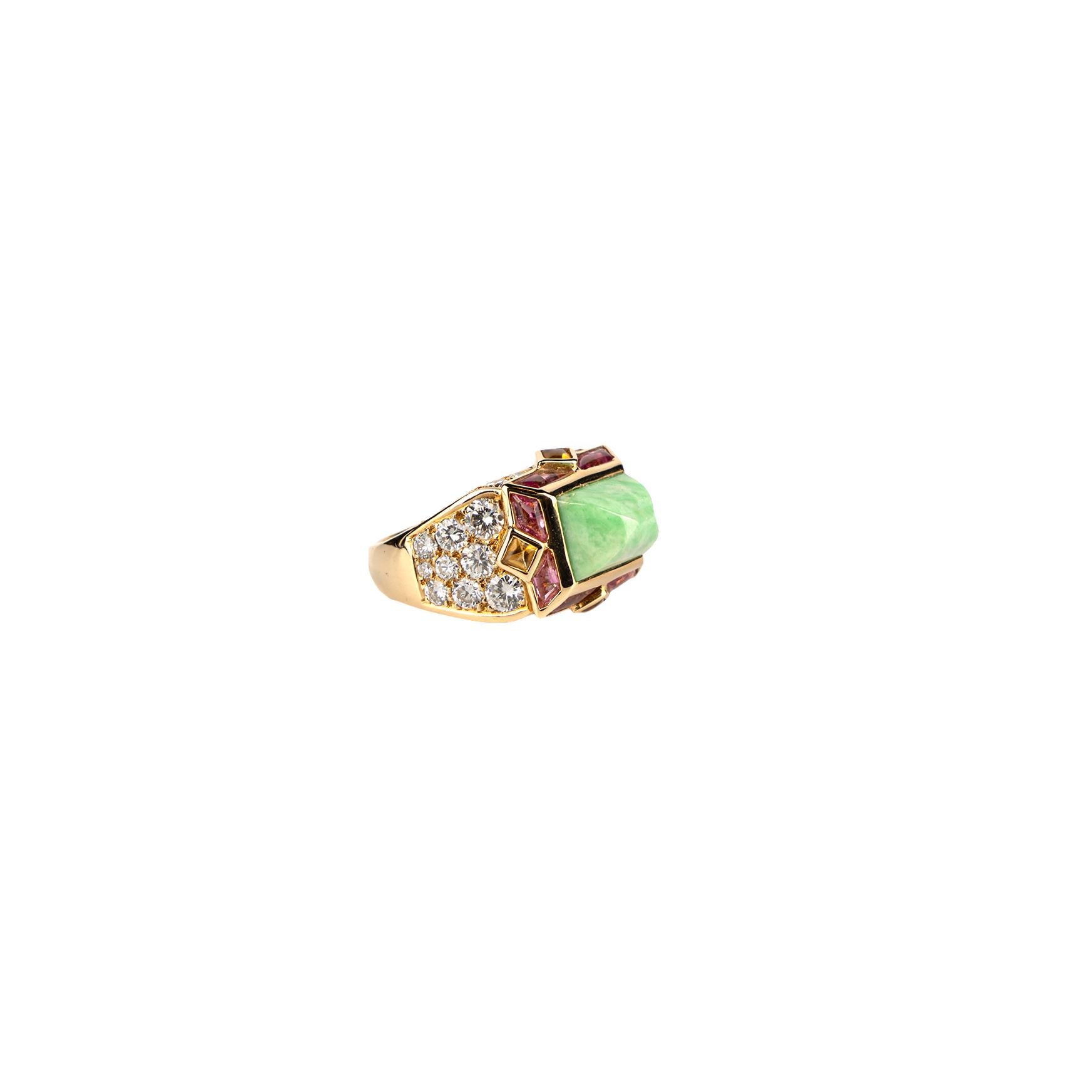 A sumptuous Mauboussin ring mounted on 18k yellow gold with jadeite, diamonds, citrine and lavender tourmaline accents. Made in France, circa 1970.
