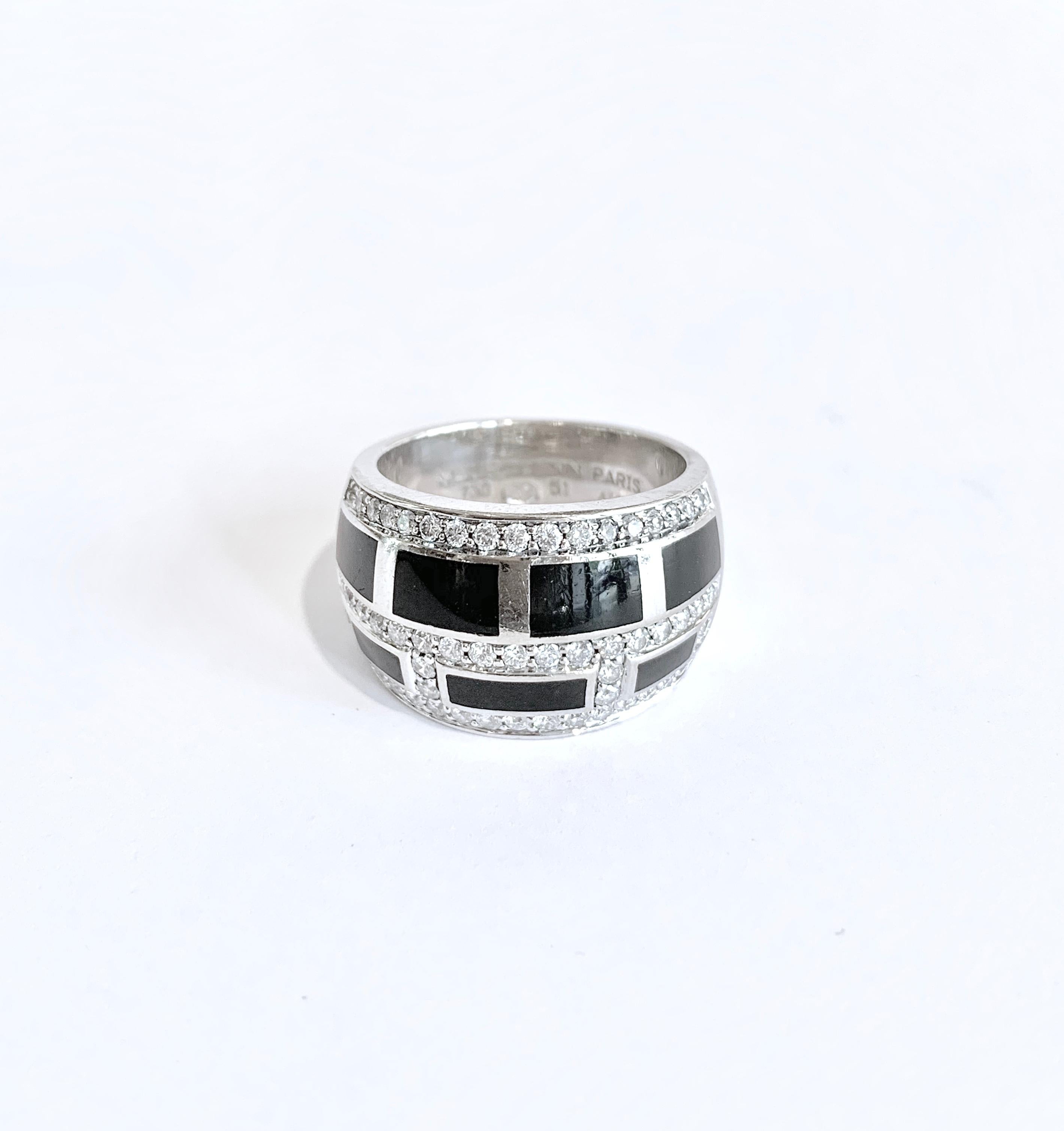 A Mauboussin “le Vice” diamonds and black lacquer 18 carats white gold ring

Diamonds weight: 0.65 carats H / SI

Numbered: AI8110

Width: 13mm

As New: bought in May 2016

Within its original box

Retails: more than 8500 euros