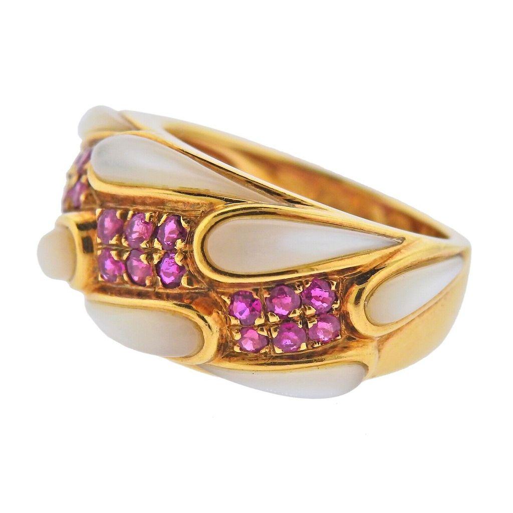 18K Gold Ring by Mauboussin. Set with mother of pearl & approx. 0.30ctw in rubies. Ring size 6.25, weight 8 grams. Marked:  Mauboussin Paris 18kt, 48688.