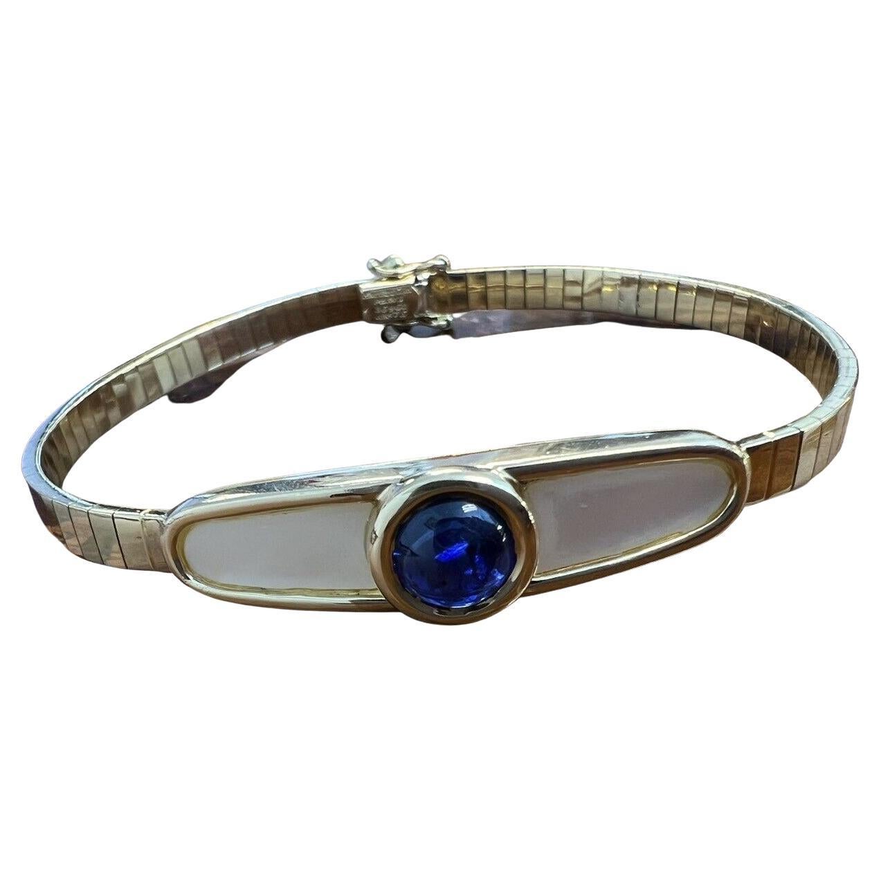 MAUBOUSSIN PARIS 18k Yellow Gold, Mother of Pearl & Sapphire Omega Bracelet 1980 For Sale